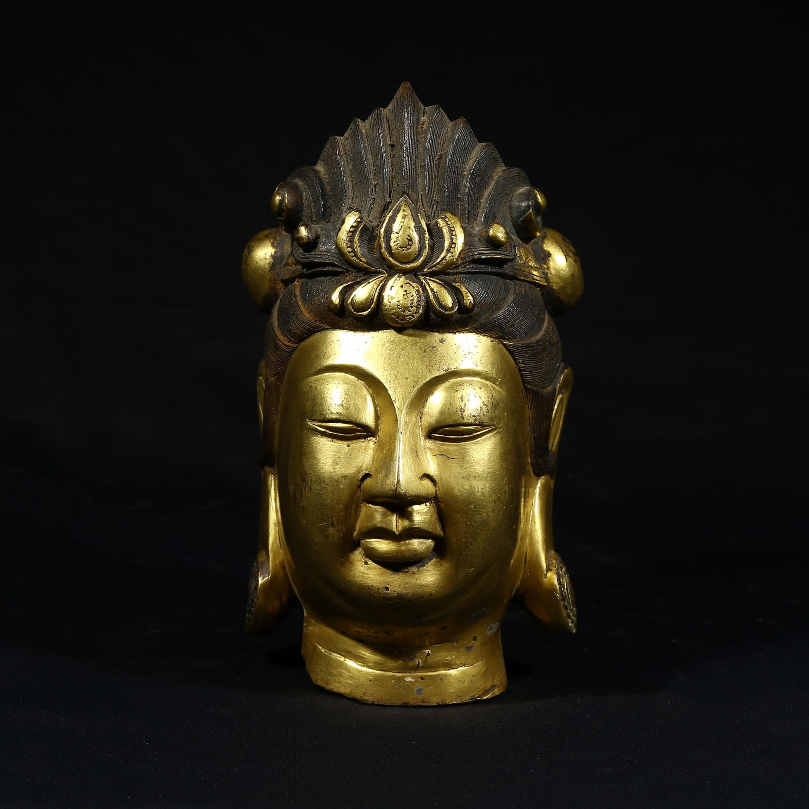 A GILDED BRONZE HEAD OF A BODHISATTVA (1 of 8)