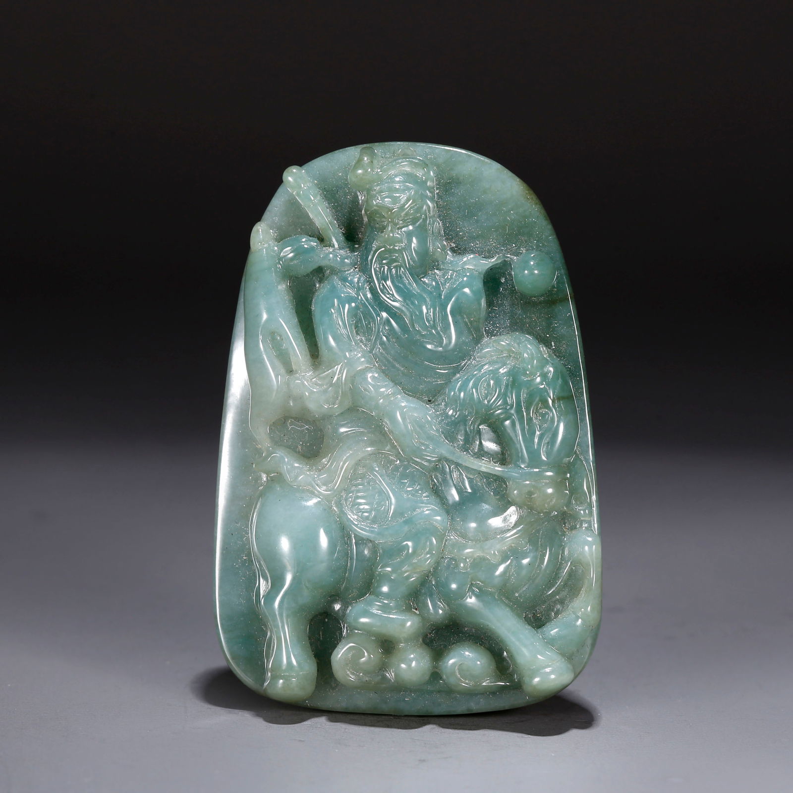 A JADEITE PENDANT CARVED WITH GUAN GONG PATTERN: Jadeite Pendant Carved with Guan Gong Pattern