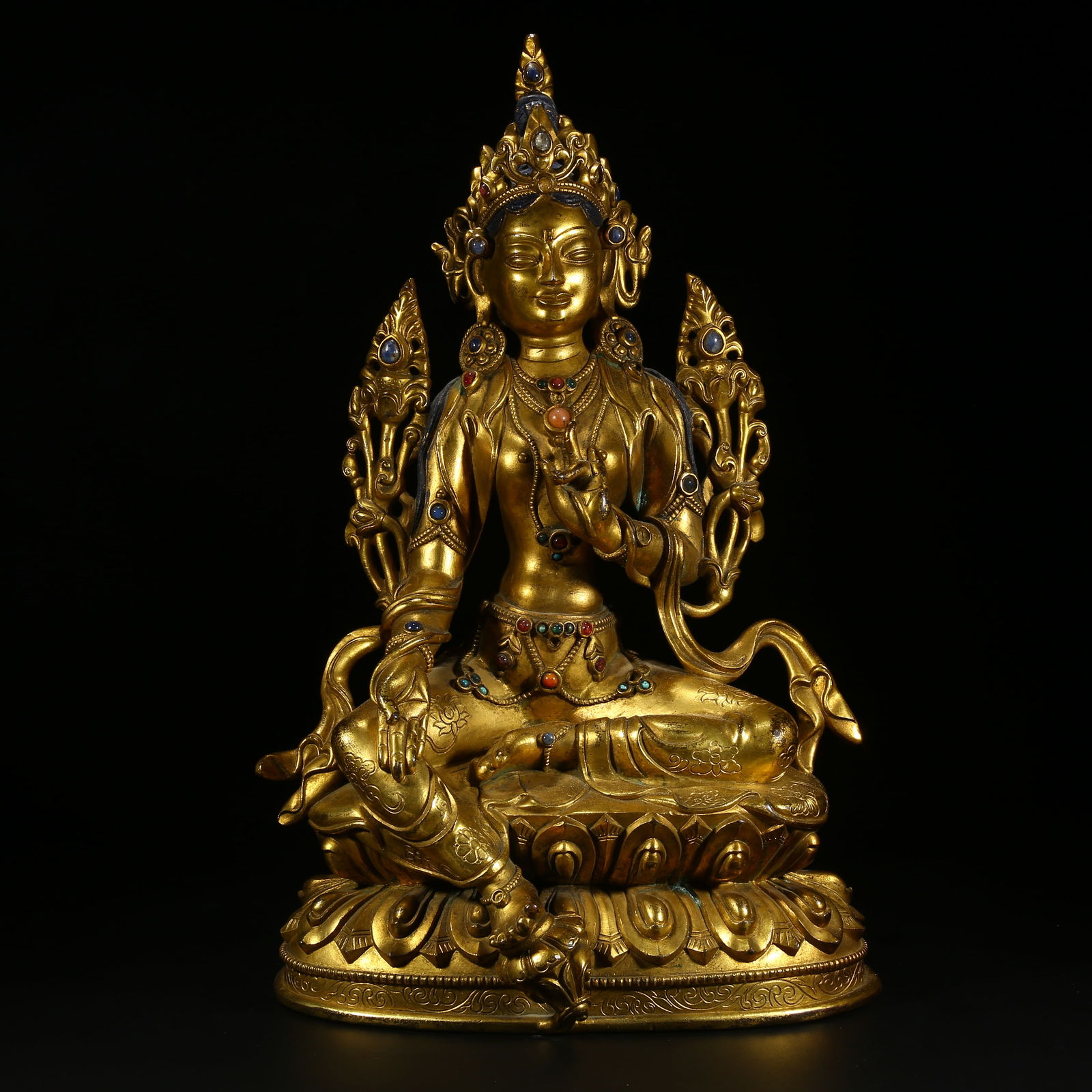 A GILDED BRONZE STATUE OF GREEN TARA INLAID WITH GEMSTONES (1 of 8)