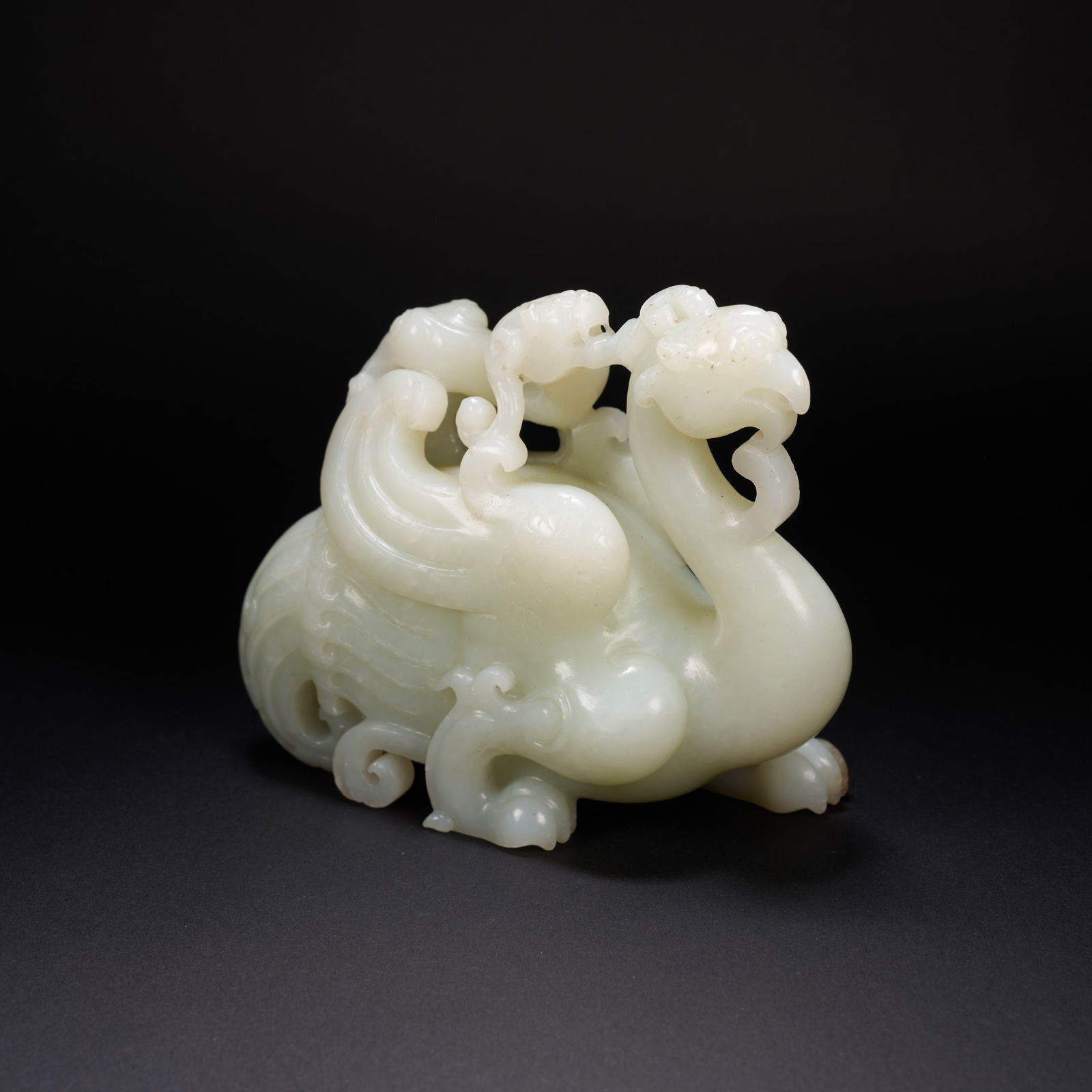 A HETIAN JADE DRAGON-AND-PHOENIX ORNAMENT, HAN DYNASTY (1 of 9)