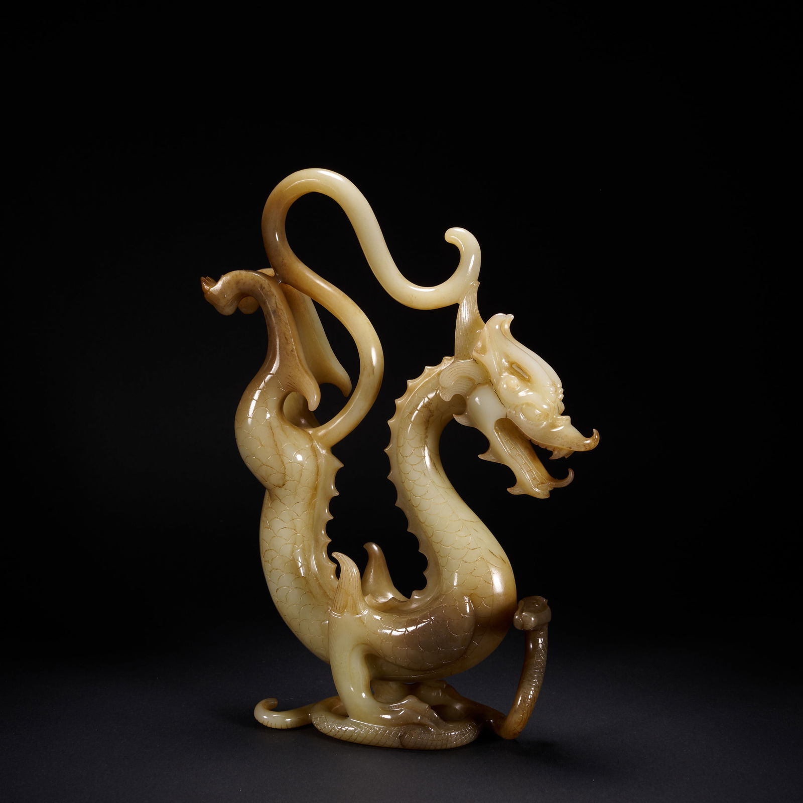 A HETIAN JADE DIVINE DRAGON ORNAMENT, HAN DYNASTY (1 of 8)