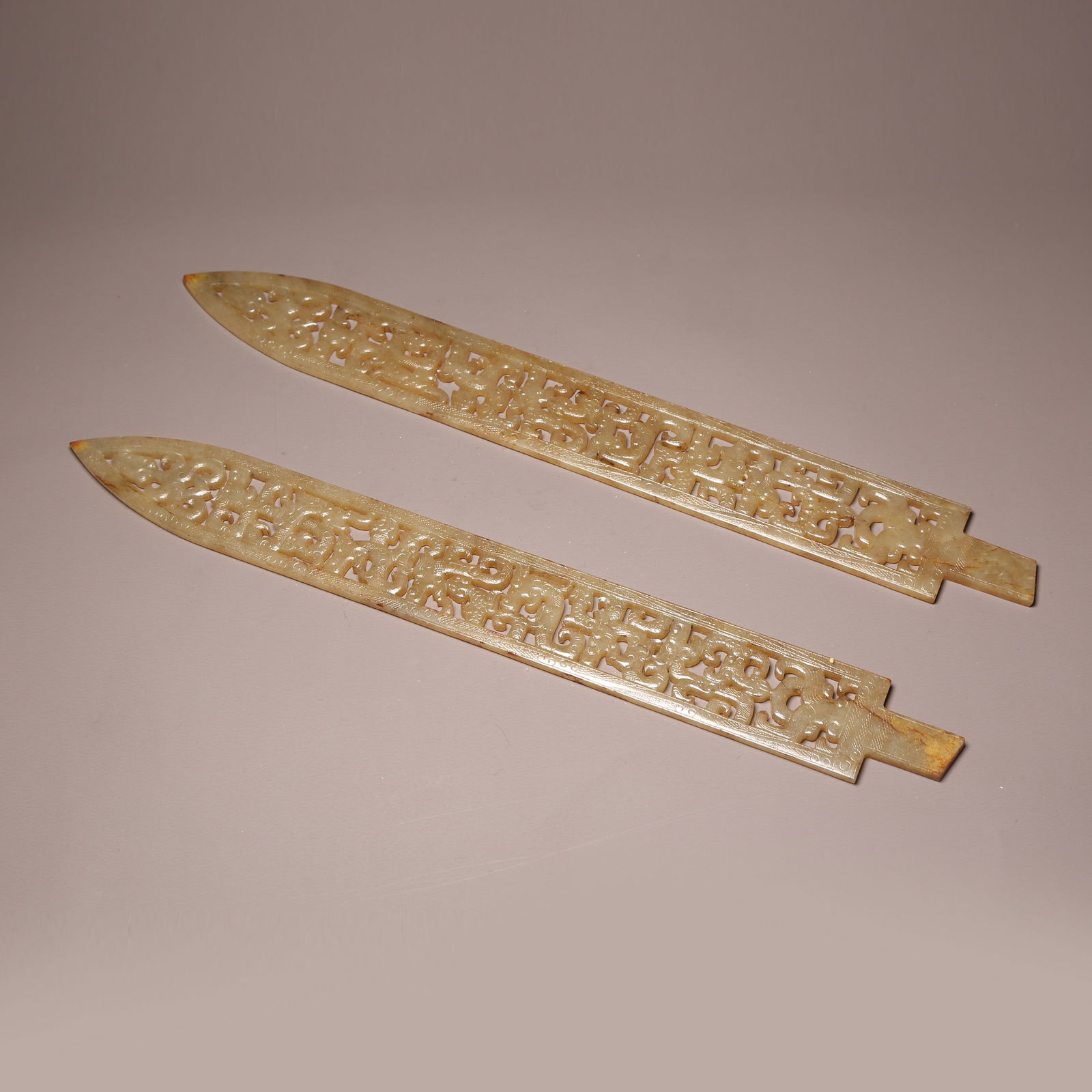 A SET OF ANCIENT JADE SWORDS WITH OPENWORK DRAGON PATTERN (1 of 9)