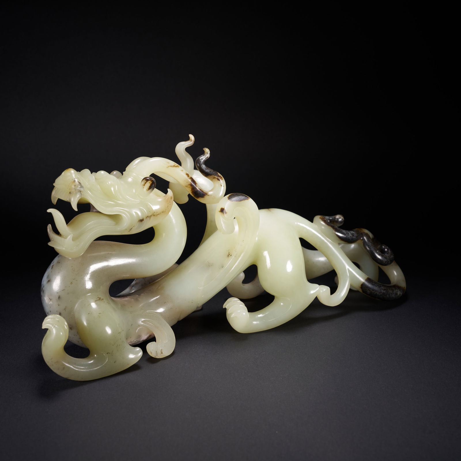 A HETIAN JADE CHI-DRAGON ORNAMENT, HAN DYNASTY (1 of 8)