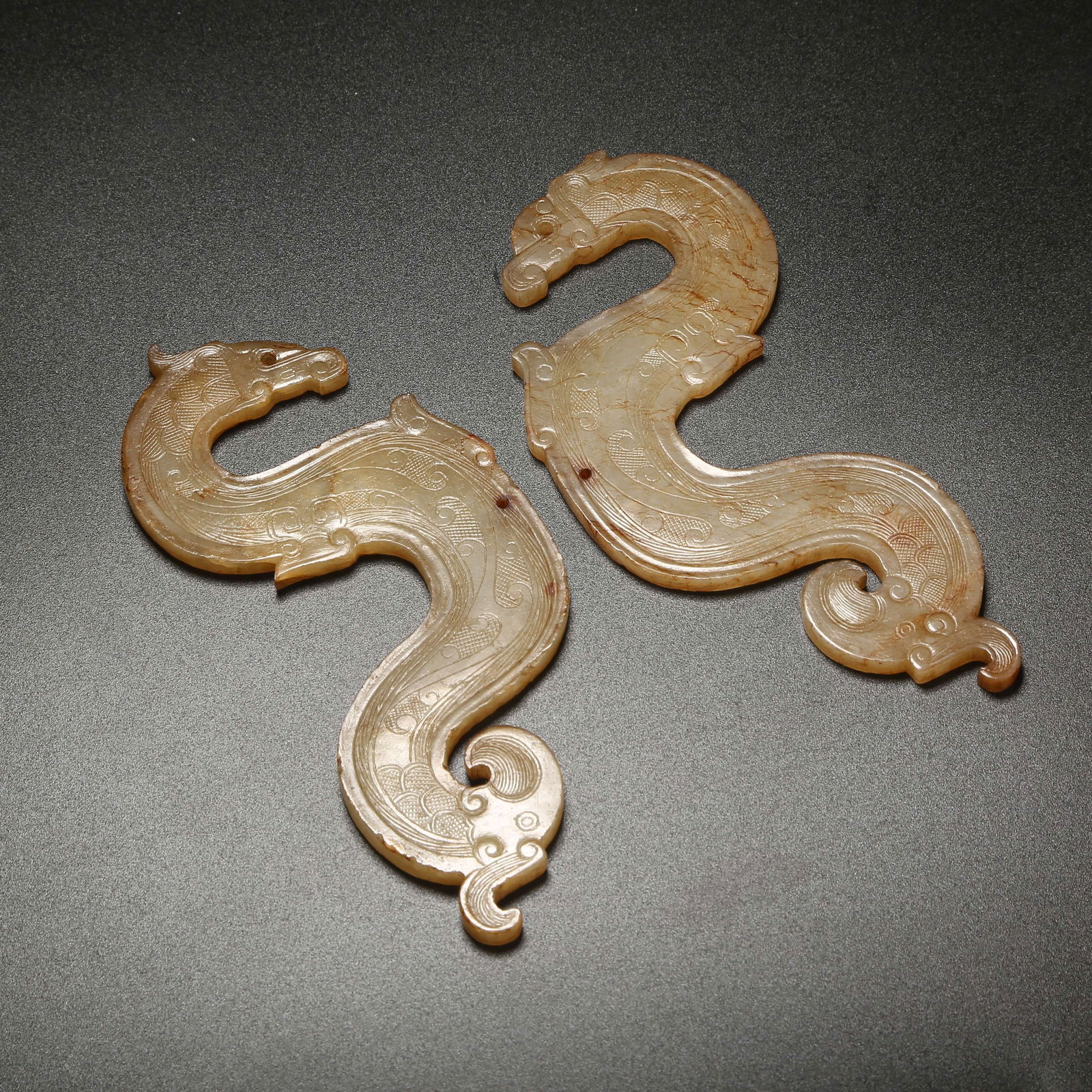 A SET OF ANCIENT JADE S-SHAPED DRAGON PENDANTS (1 of 9)