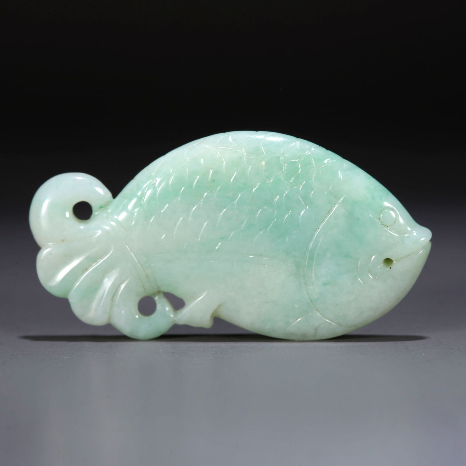 A JADEITE PENDANT CARVED WITH FISH (1 of 9)