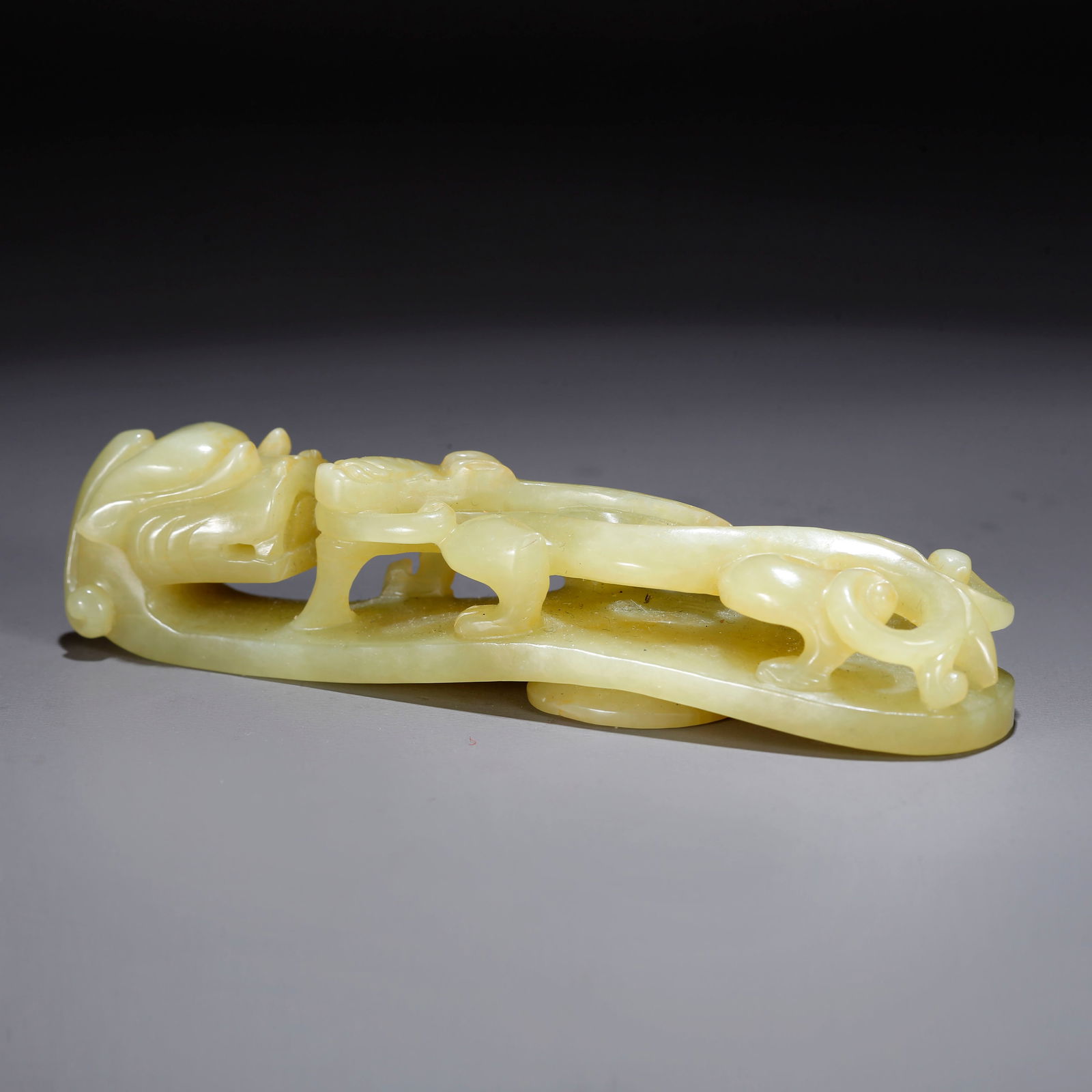 A HETIAN YELLOW JADE BELT HOOK CARVED WITH DRAGON (1 of 9)