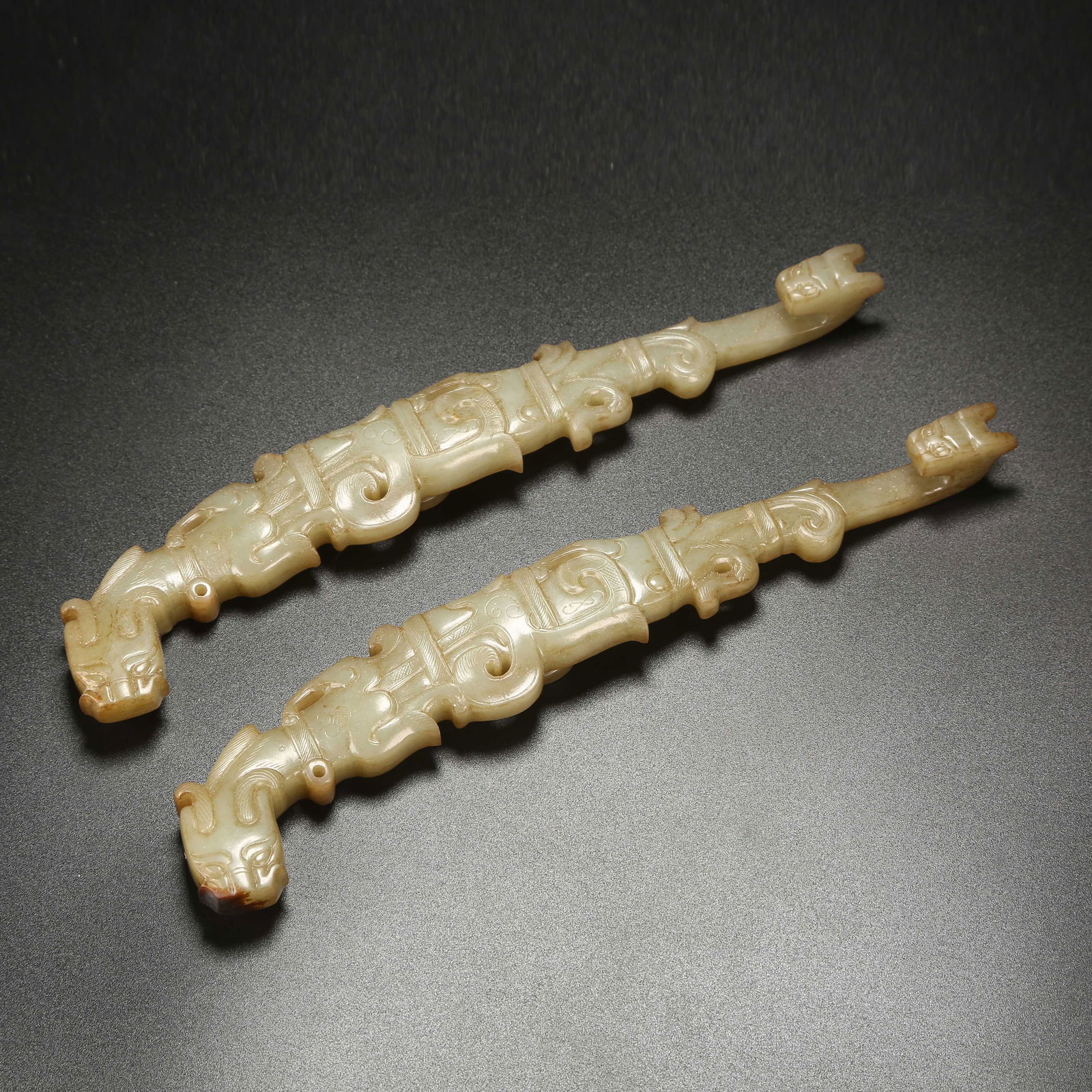 A SET OF ANCIENT JADE DRAGON-HEAD BELT HOOKS (1 of 9)