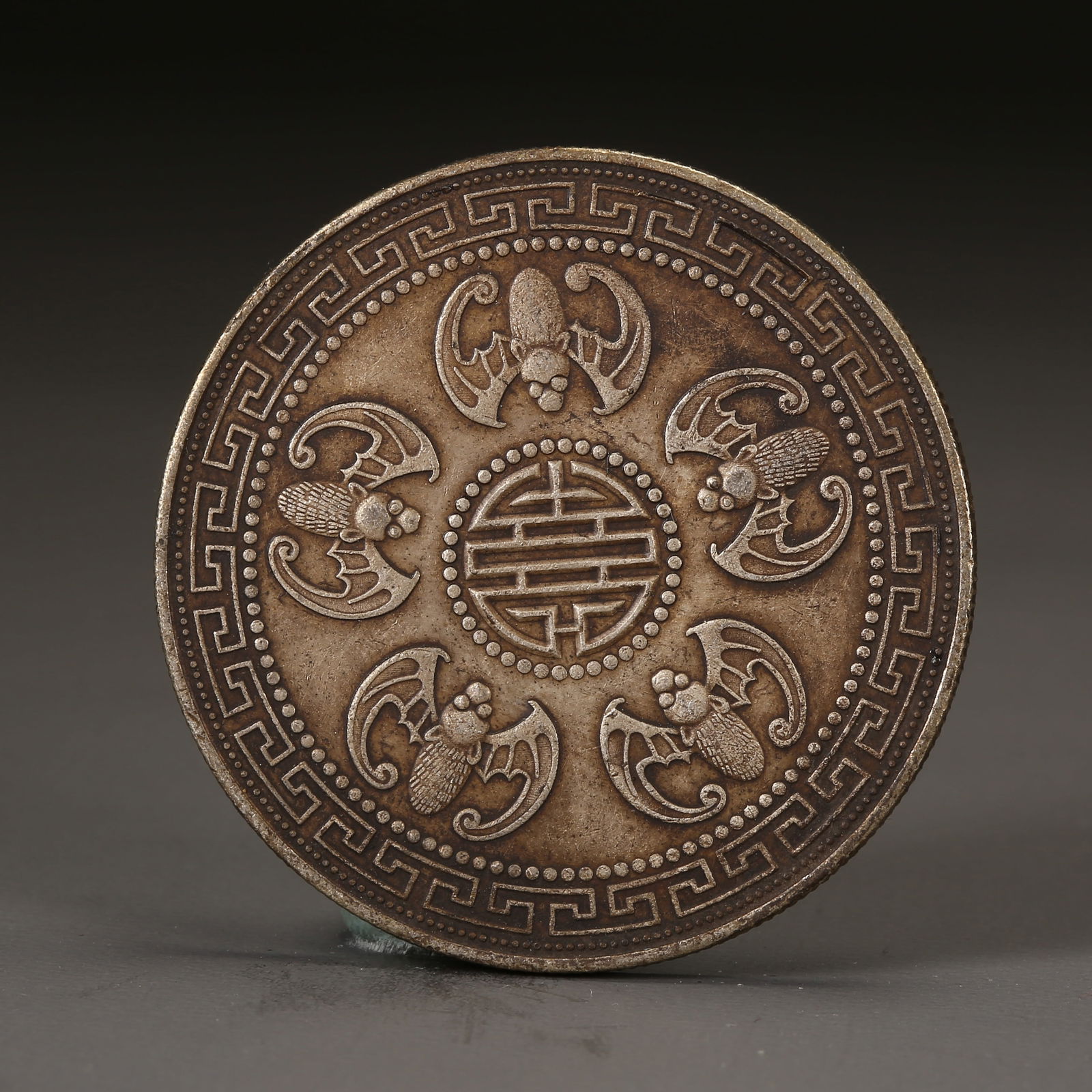 A SILVER DOLLAR COIN (1 of 3)