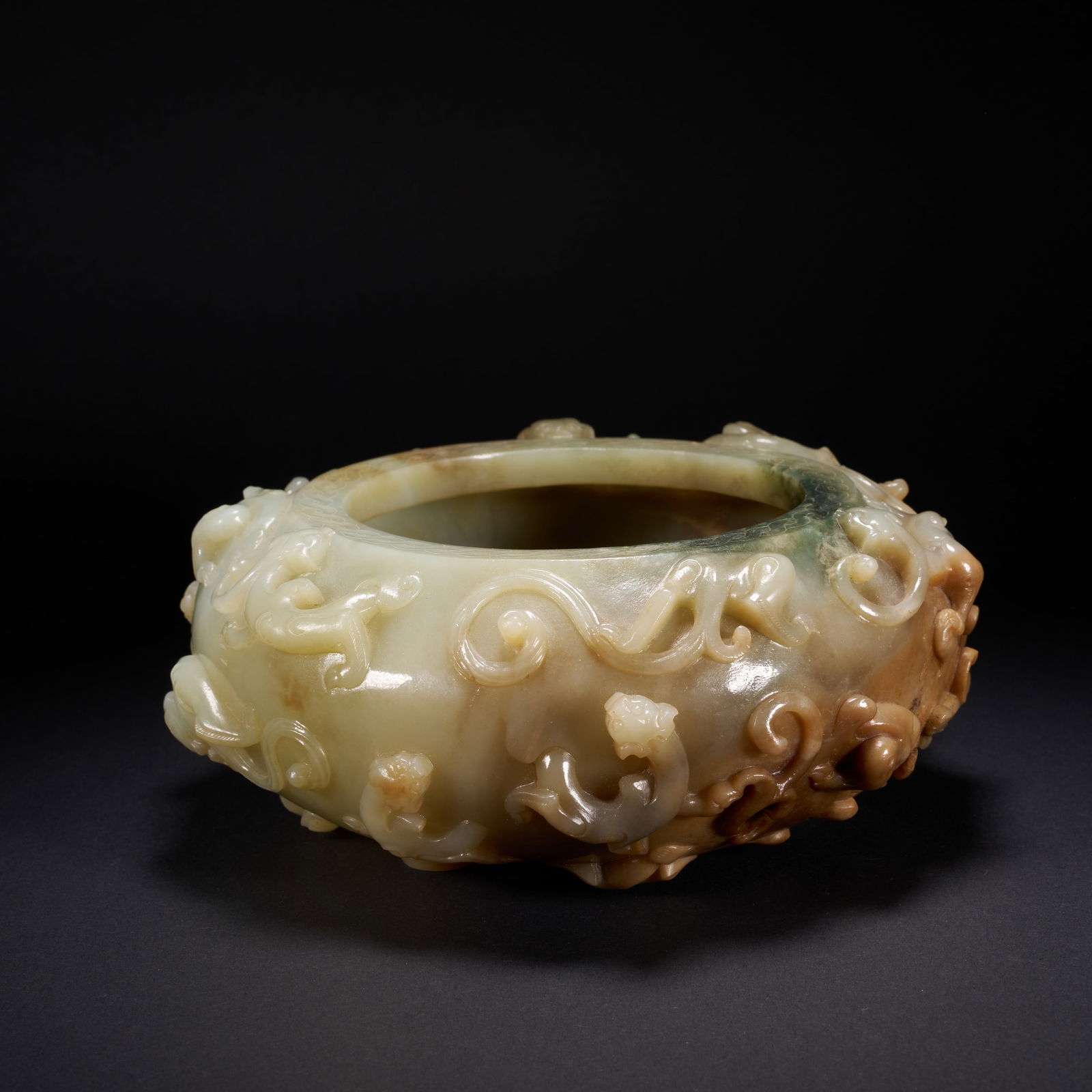 A HETIAN JADE JAR WITH RELIEF-CARVED CHI-DRAGON MOTIFS, HAN DYNASTY (1 of 7)