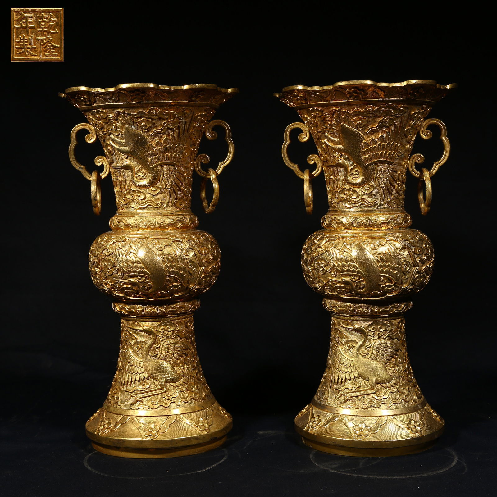 A GILDED BRONZE ZUN VESSEL WITH CLOUD AND CRANE MOTIFS (SET) (1 of 10)