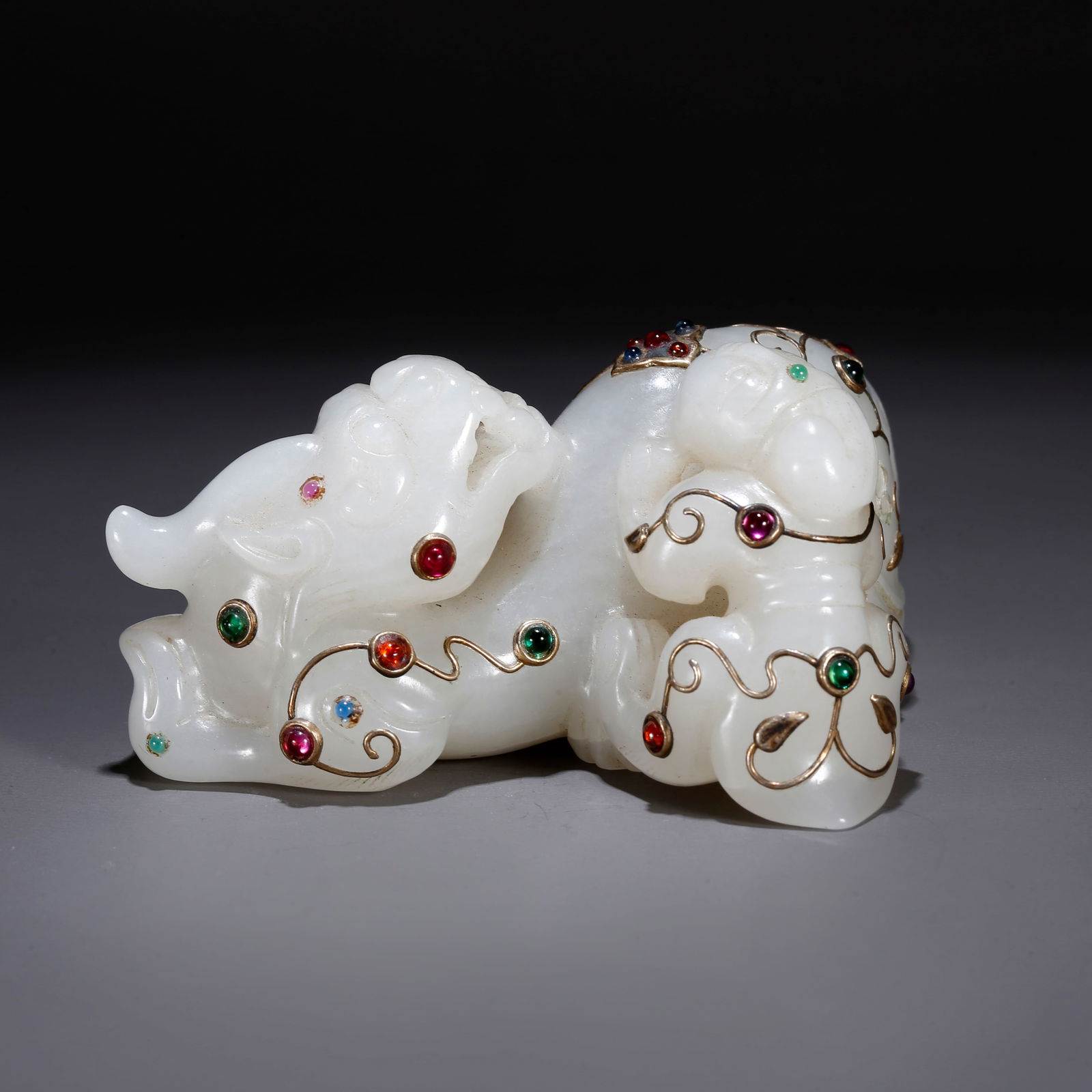 A HETIAN JADE CARVED BARBARIAN TAMING BEAST ORNAMENT (1 of 10)
