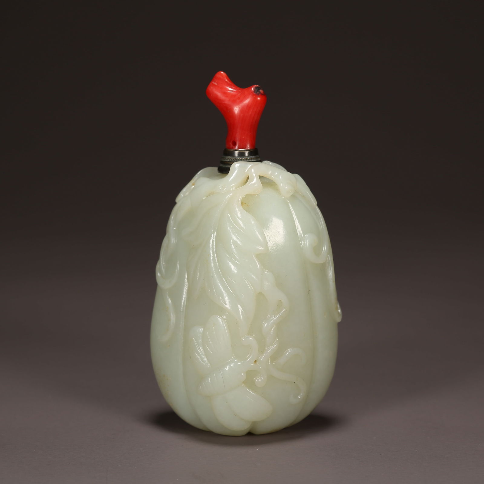 A HETIAN JADE SNUFF BOTTLE IN THE SHAPE OF AN AUSPICIOUS FRUIT: Hetian Jade Snuff Bottle in the Shape of an Auspicious Fruit