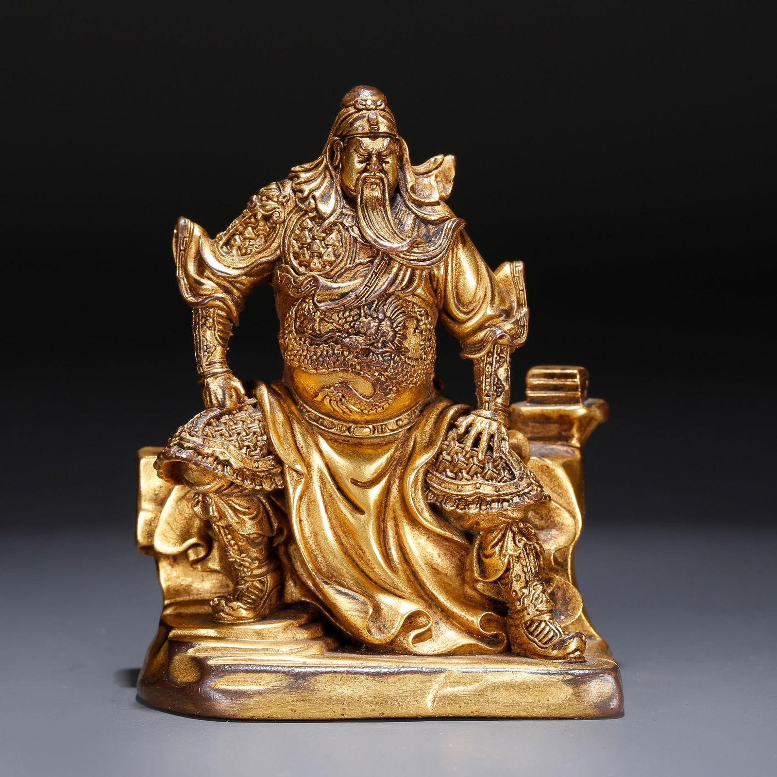 A GILT BRONZE STATUE OF GUAN GONG: Gilt Bronze Statue of Guan Gong