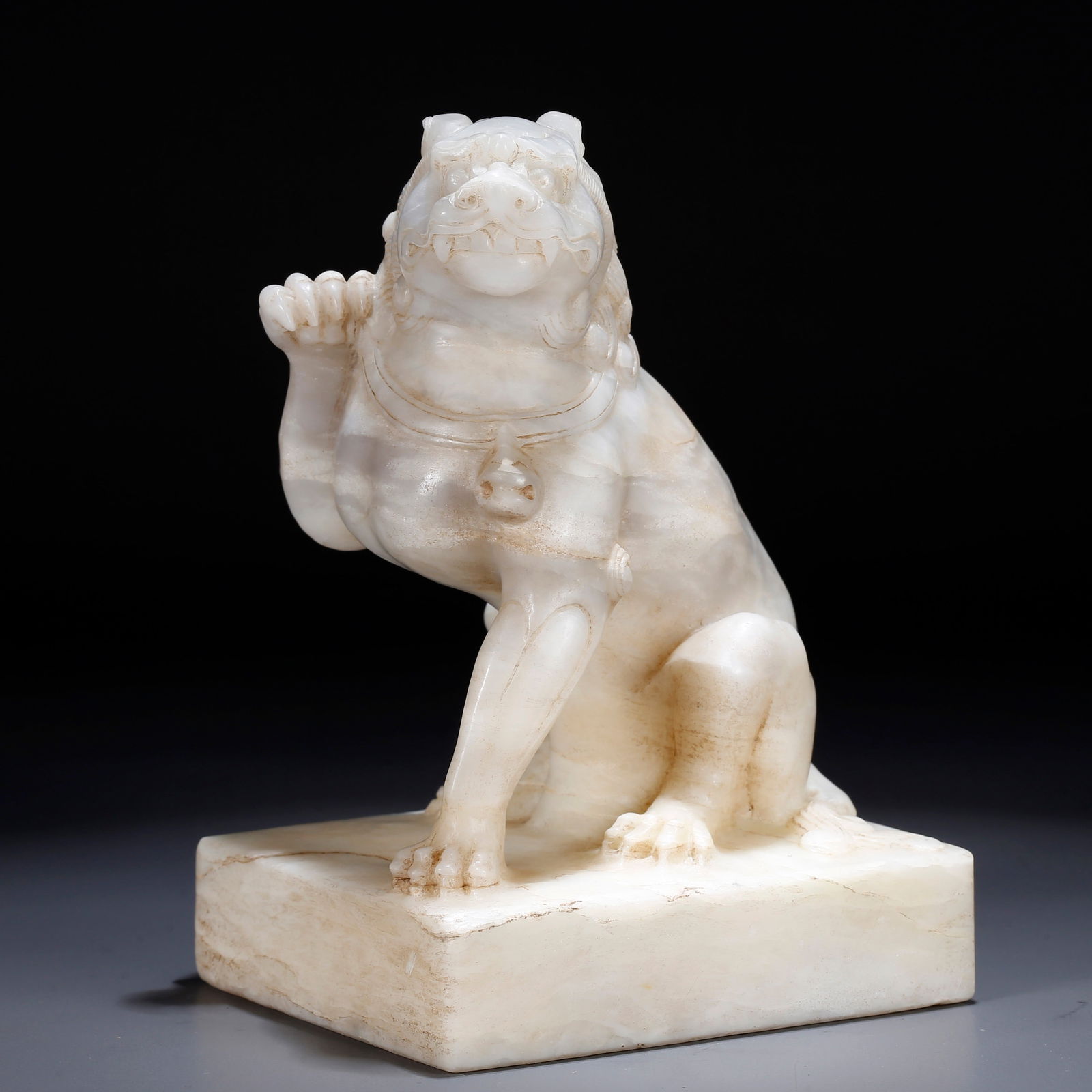 A HAN WHITE JADE TIGER-SHAPED ORNAMENT: Han White Jade Tiger-Shaped Ornament