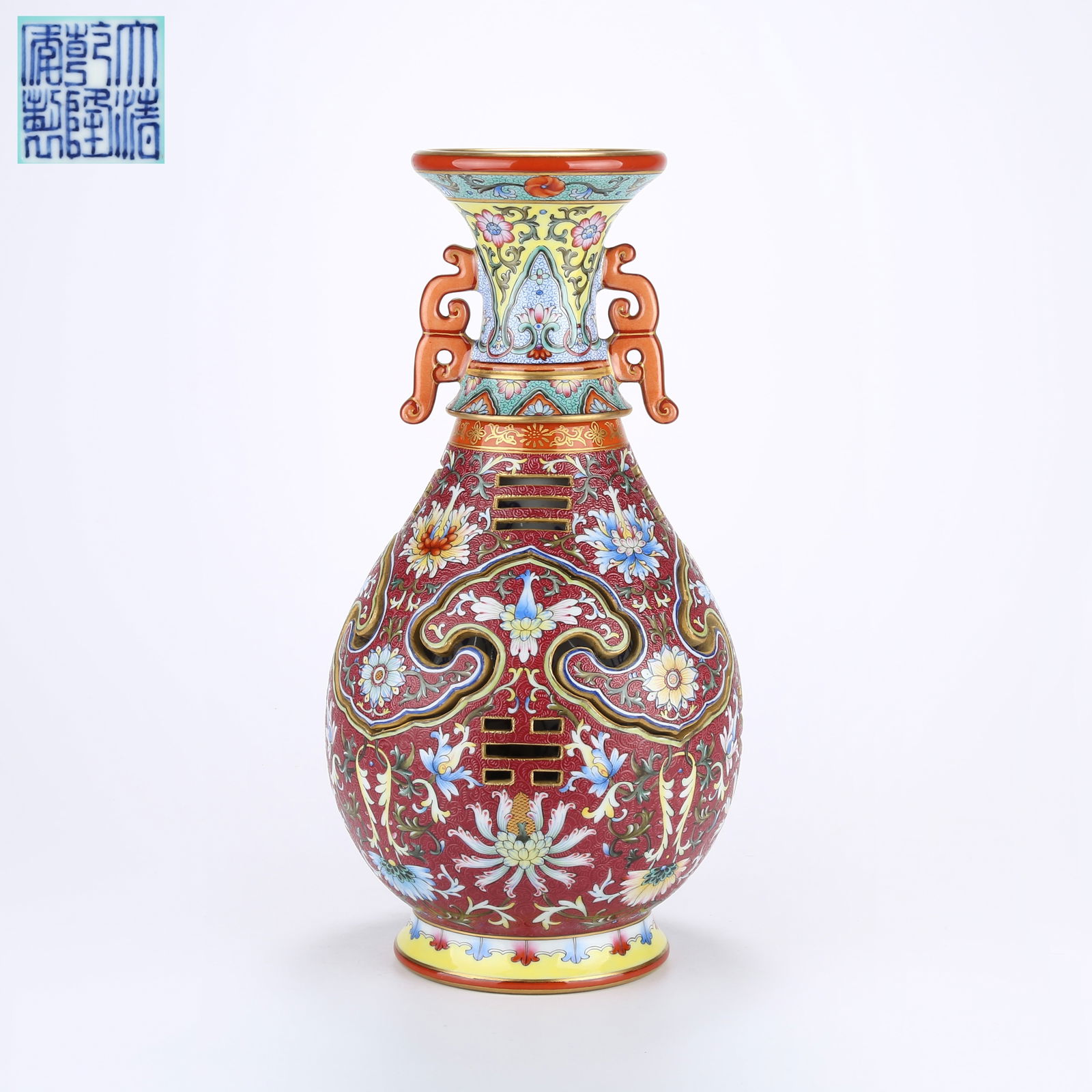 A YANGCAI REVOLVING VASE WITH CARVED PEONY SCROLLS ON ROUGE-PINK GROUND: Yangcai Revolving Vase with Carved Peony Scrolls on Rouge-Pink Ground