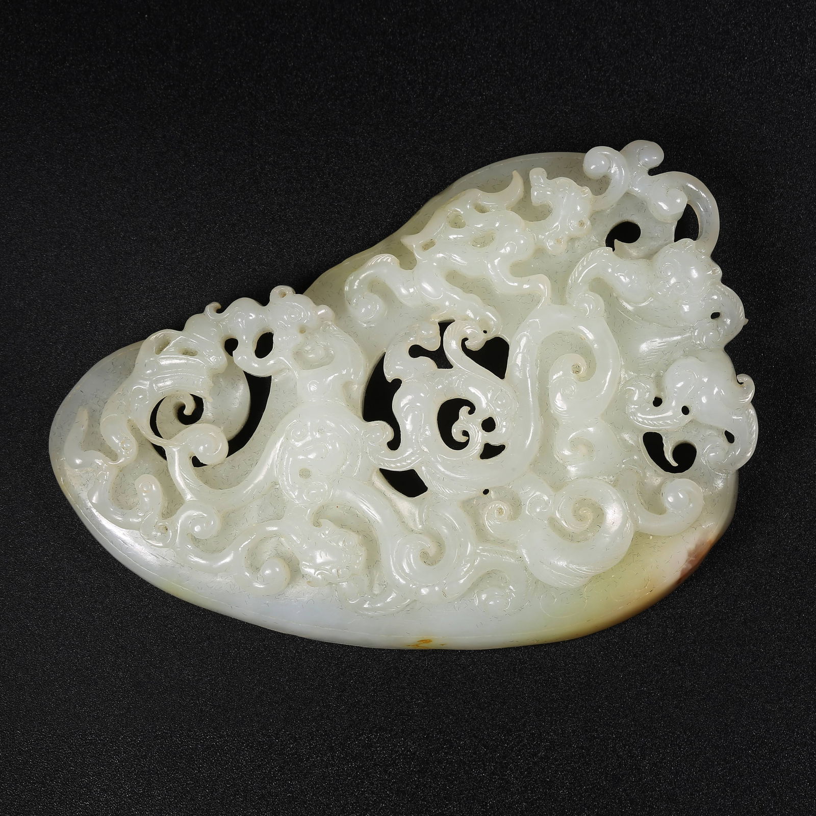 A HETIAN JADE CHILON (HORNLESS DRAGON) MOTIF "CHICKEN-HEART" PENDANT (1 of 8)