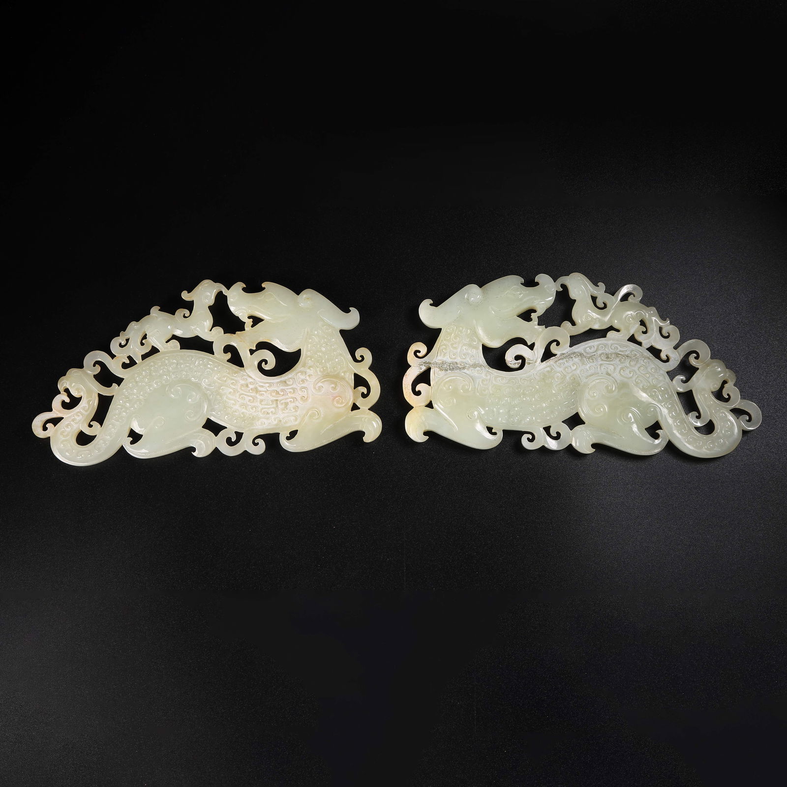 A ARCHAIC JADE DOUBLE-DRAGON PENDANT (1 of 10)