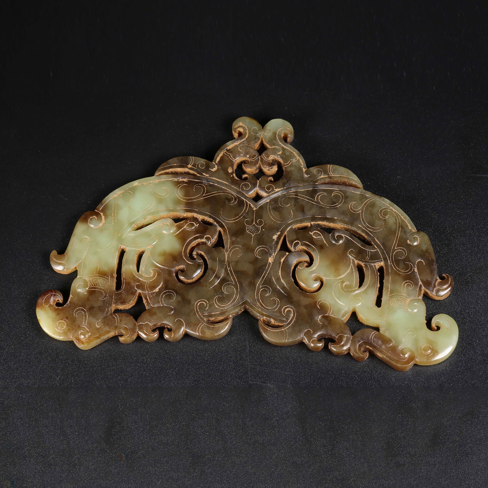 A ARCHAIC JADE DOUBLE-DRAGON PENDANT (1 of 9)