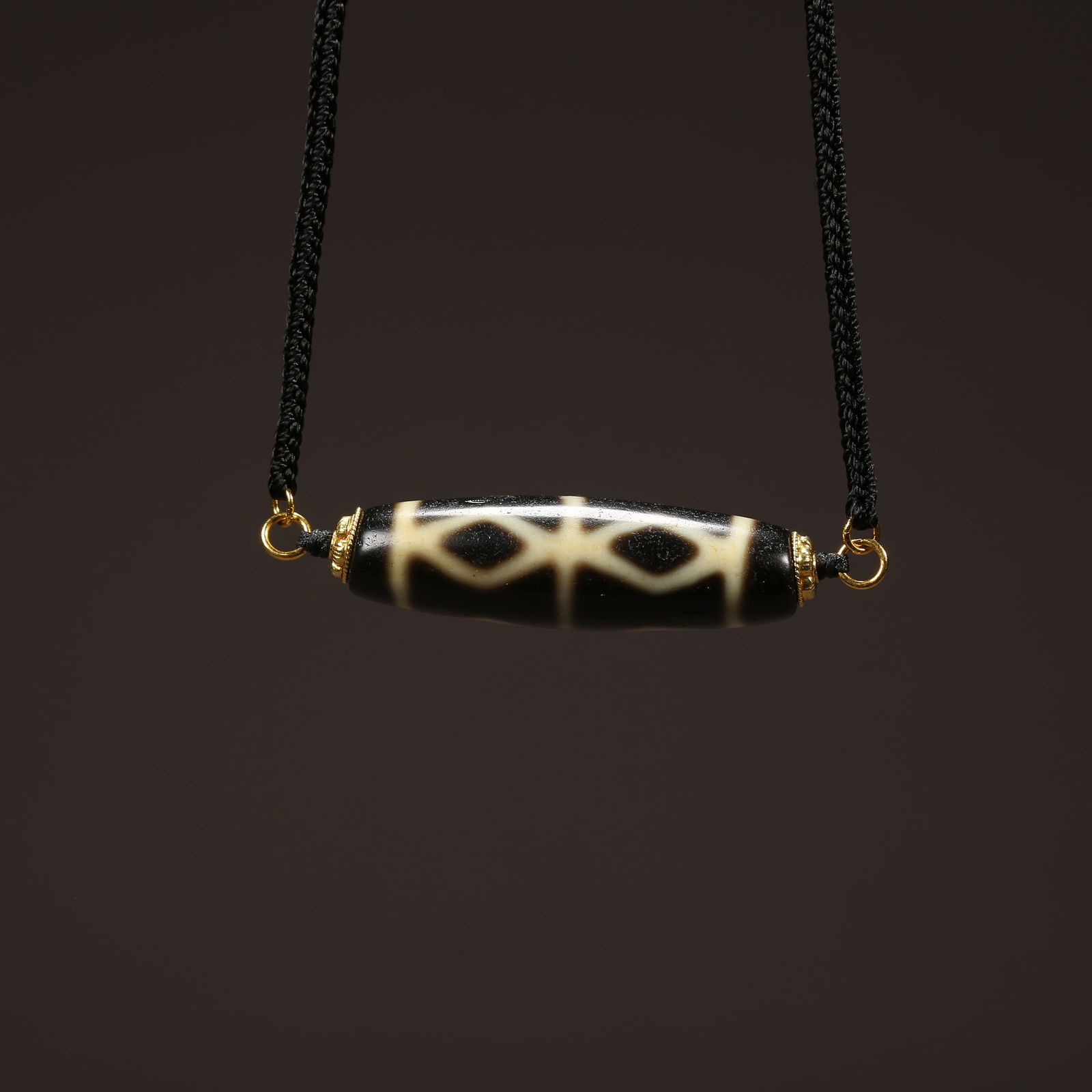 A STRAND OF AGATE DZI BEAD (1 of 8)