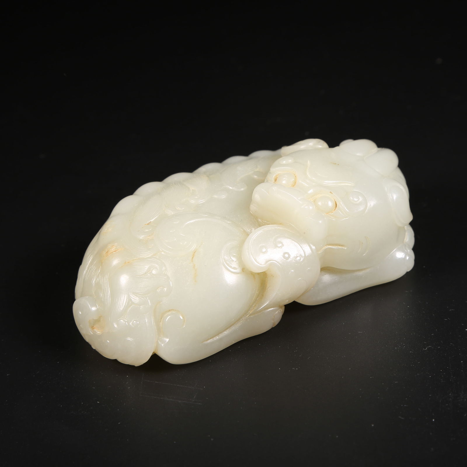 A HETIAN JADE AUSPICIOUS BEAST HAND-HELD ORNAMENT (1 of 8)