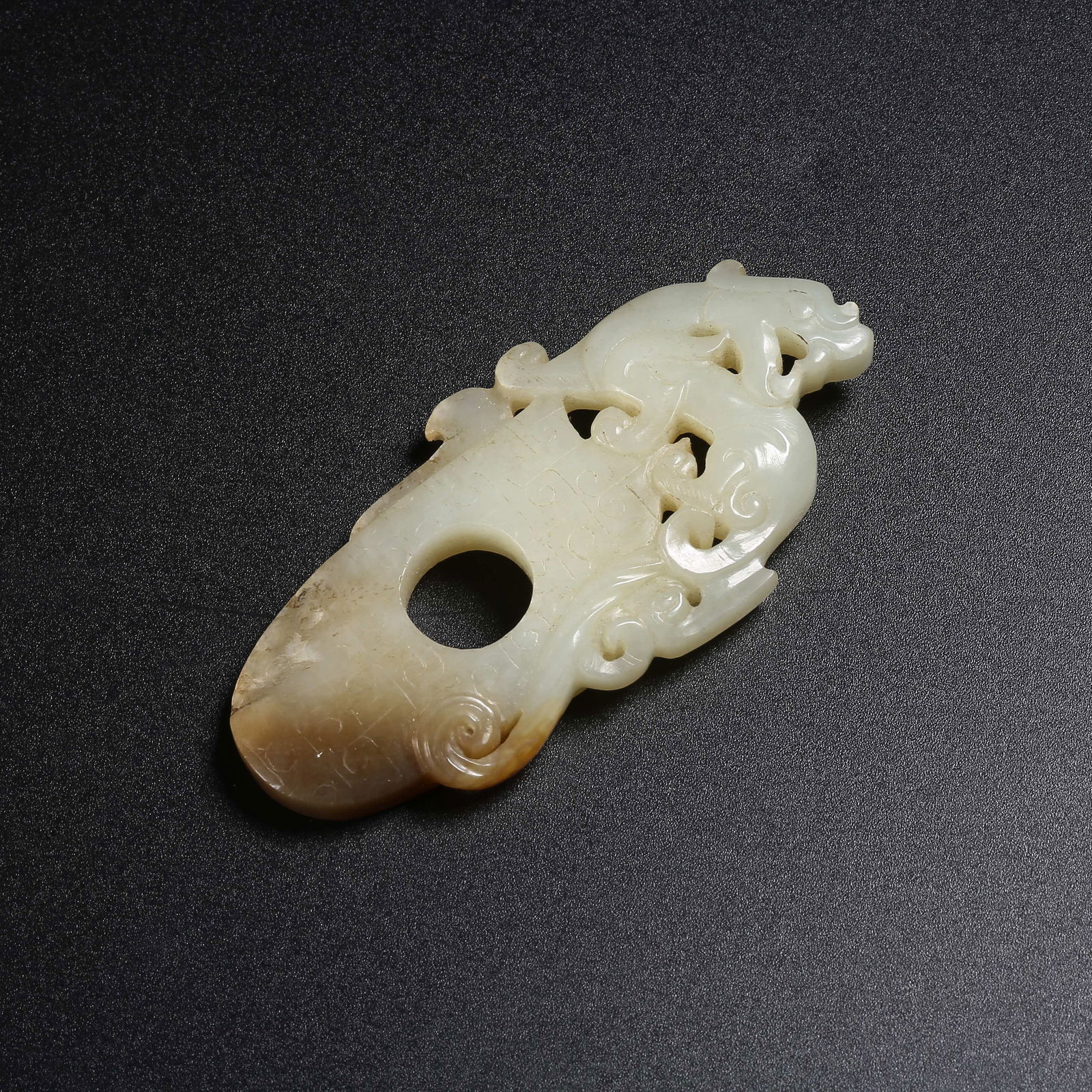 A HETIAN JADE CHILONG (HORNLESS DRAGON) "CHICKEN-HEART" PENDANT (1 of 9)