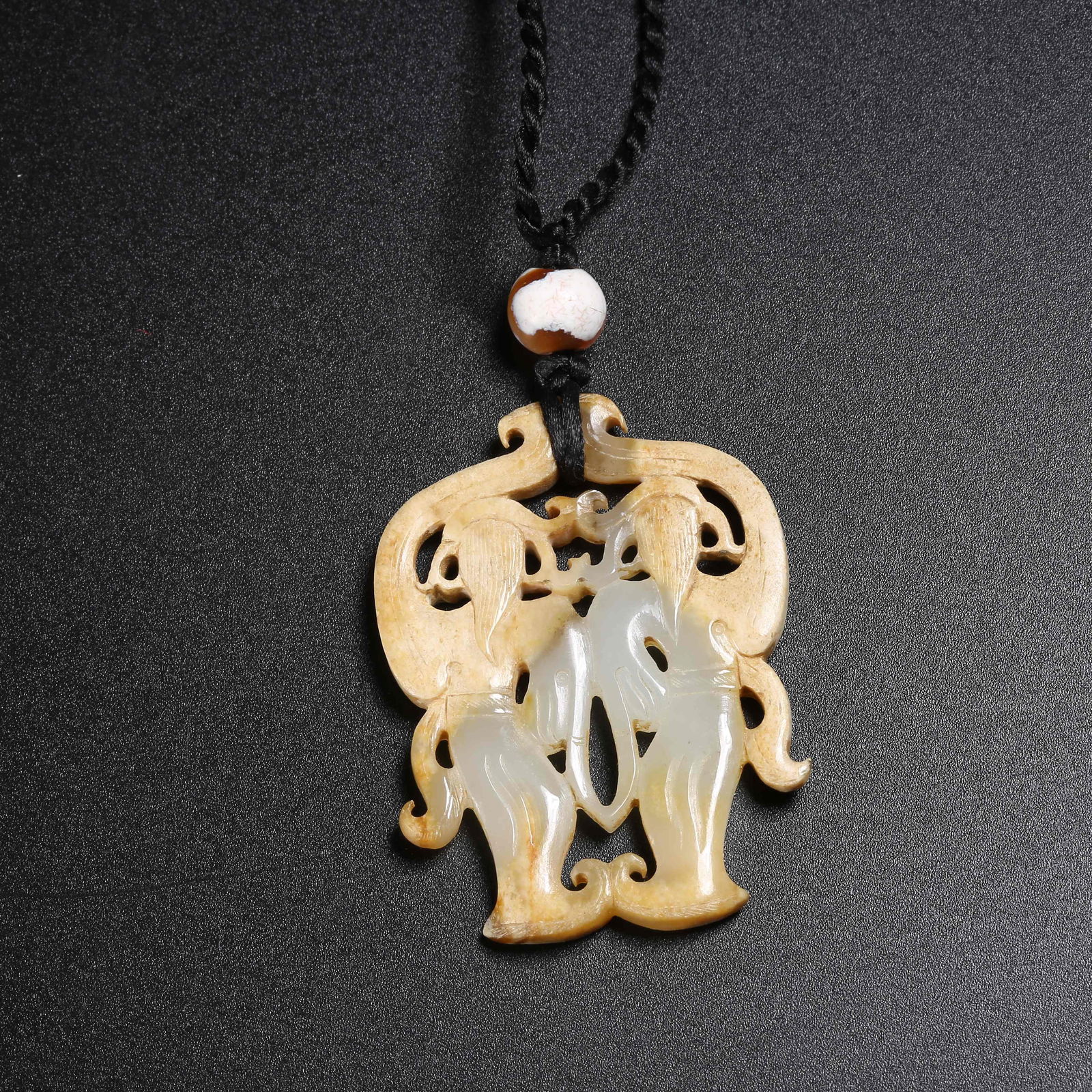 A ARCHAIC JADE DANCER PENDANT (1 of 9)