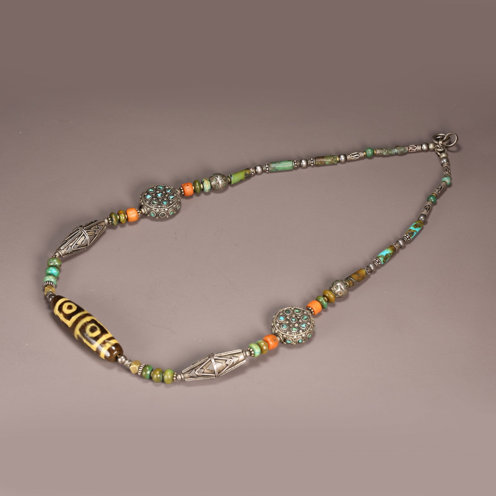 A STRAND OF AGATE DZI BEAD (1 of 11)