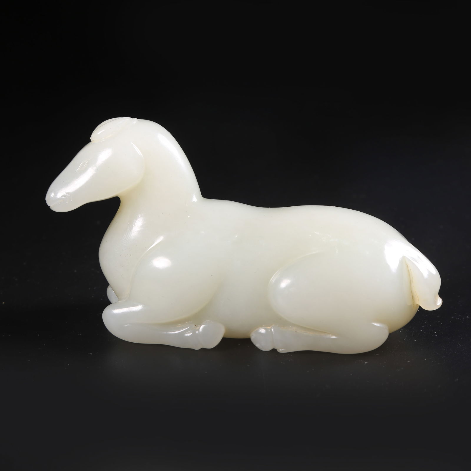A HETIAN WHITE JADE RECUMBENT HORSE ORNAMENT (1 of 8)