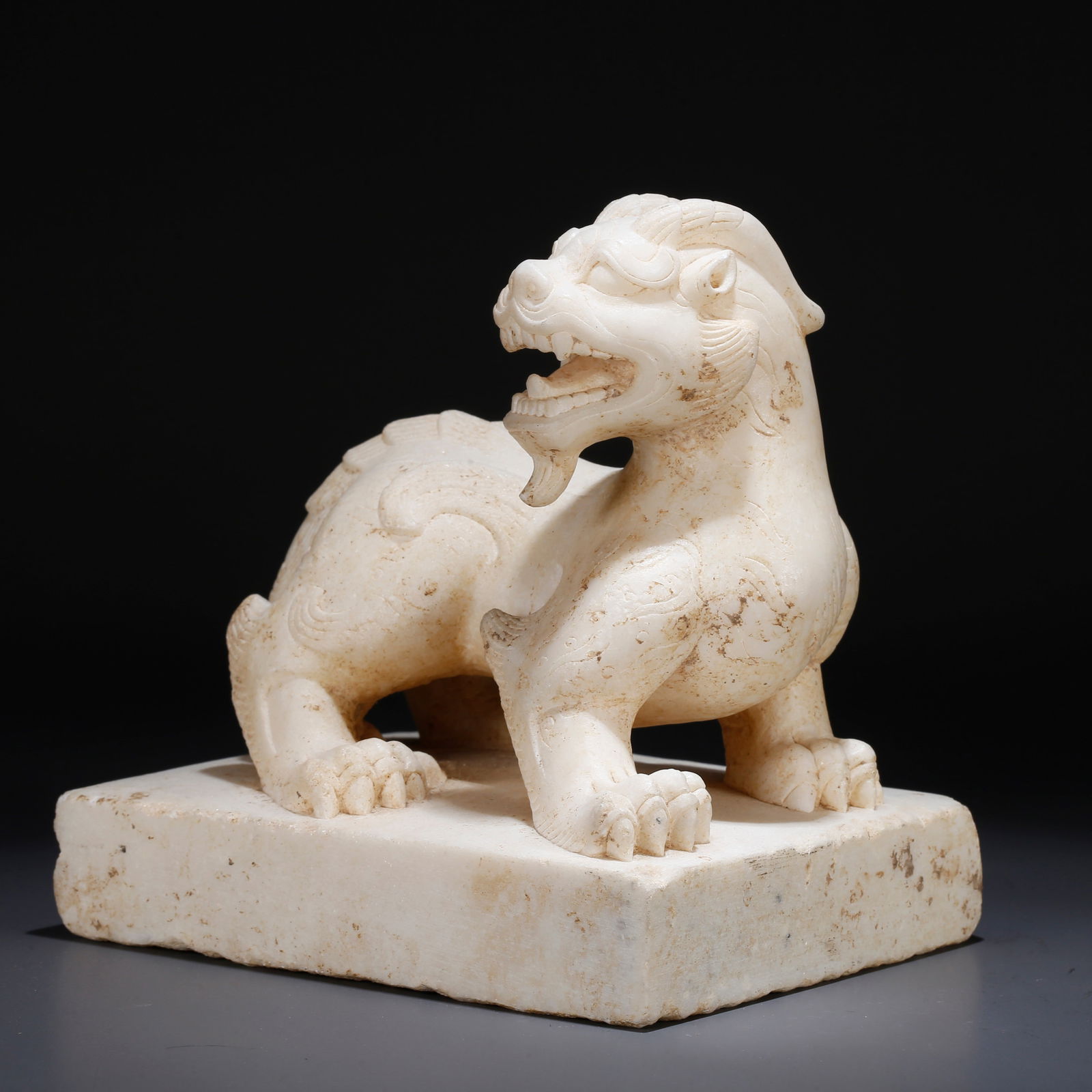 A HAN WHITE JADE TIGER ORNAMENT: Han White Jade Tiger Ornament