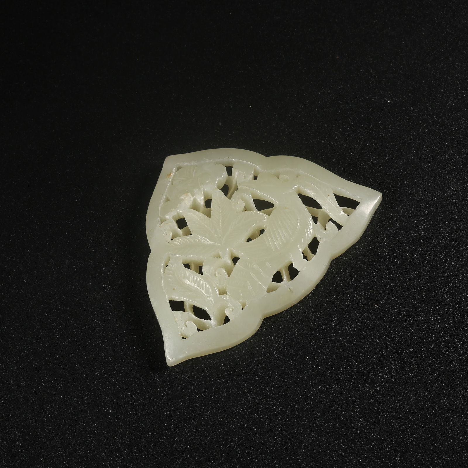 A HETIAN JADE BELT PLAQUE CARVED WITH AUSPICIOUS BEAST MOTIFS (1 of 9)