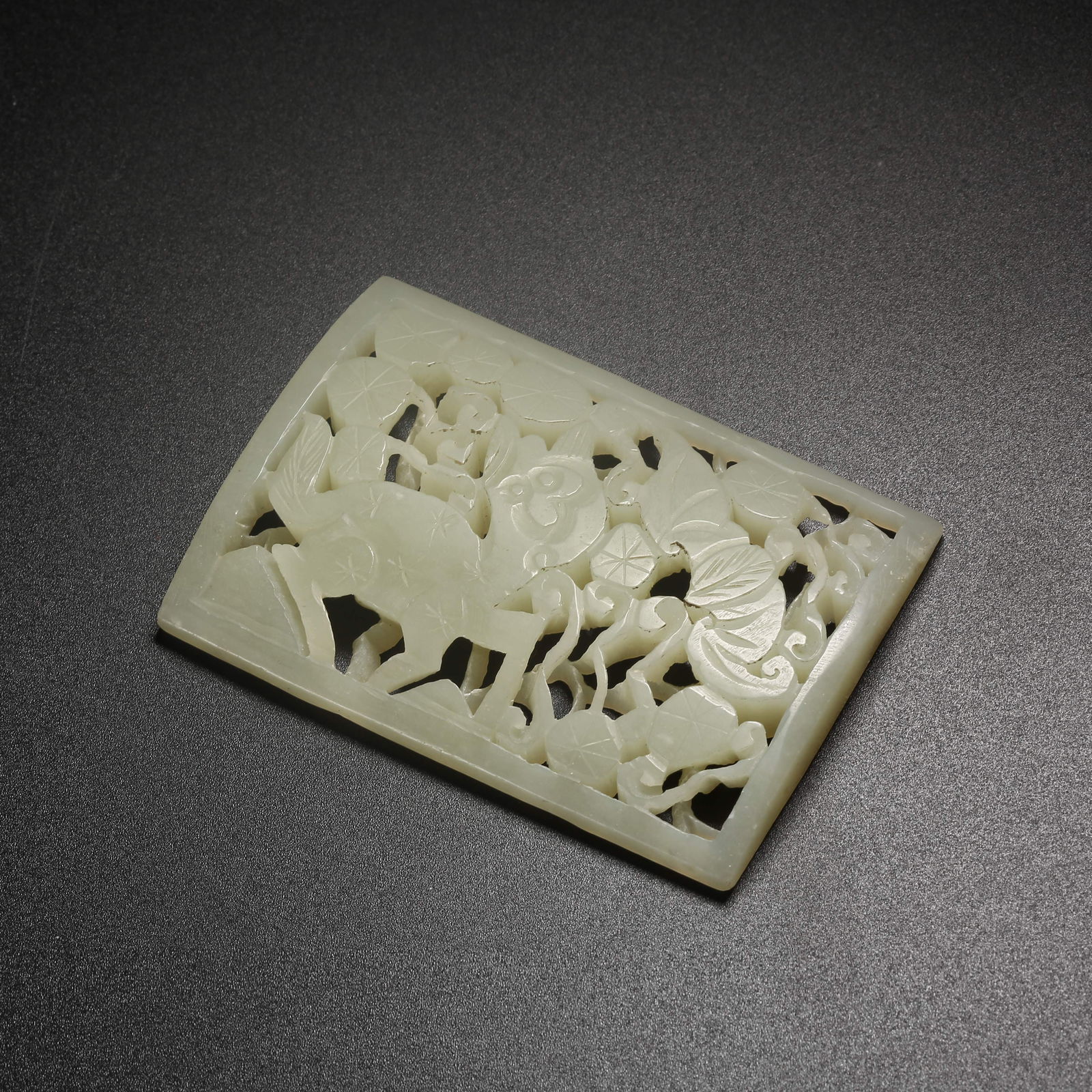 A HETIAN JADE BELT PLAQUE CARVED WITH AUSPICIOUS BEAST MOTIFS (1 of 8)