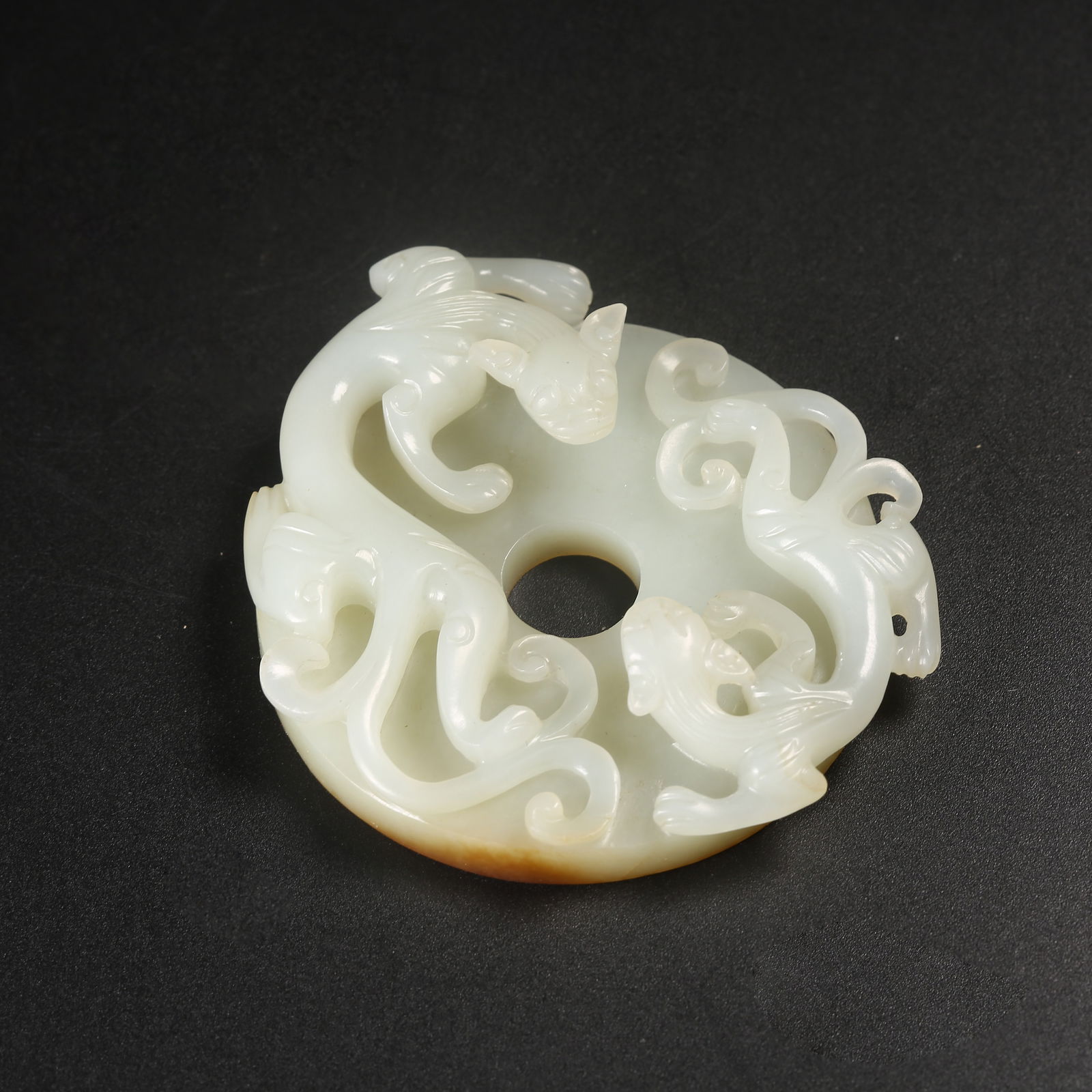 A HETIAN JADE BI DISK WITH CHI-DRAGON MOTIF (1 of 9)