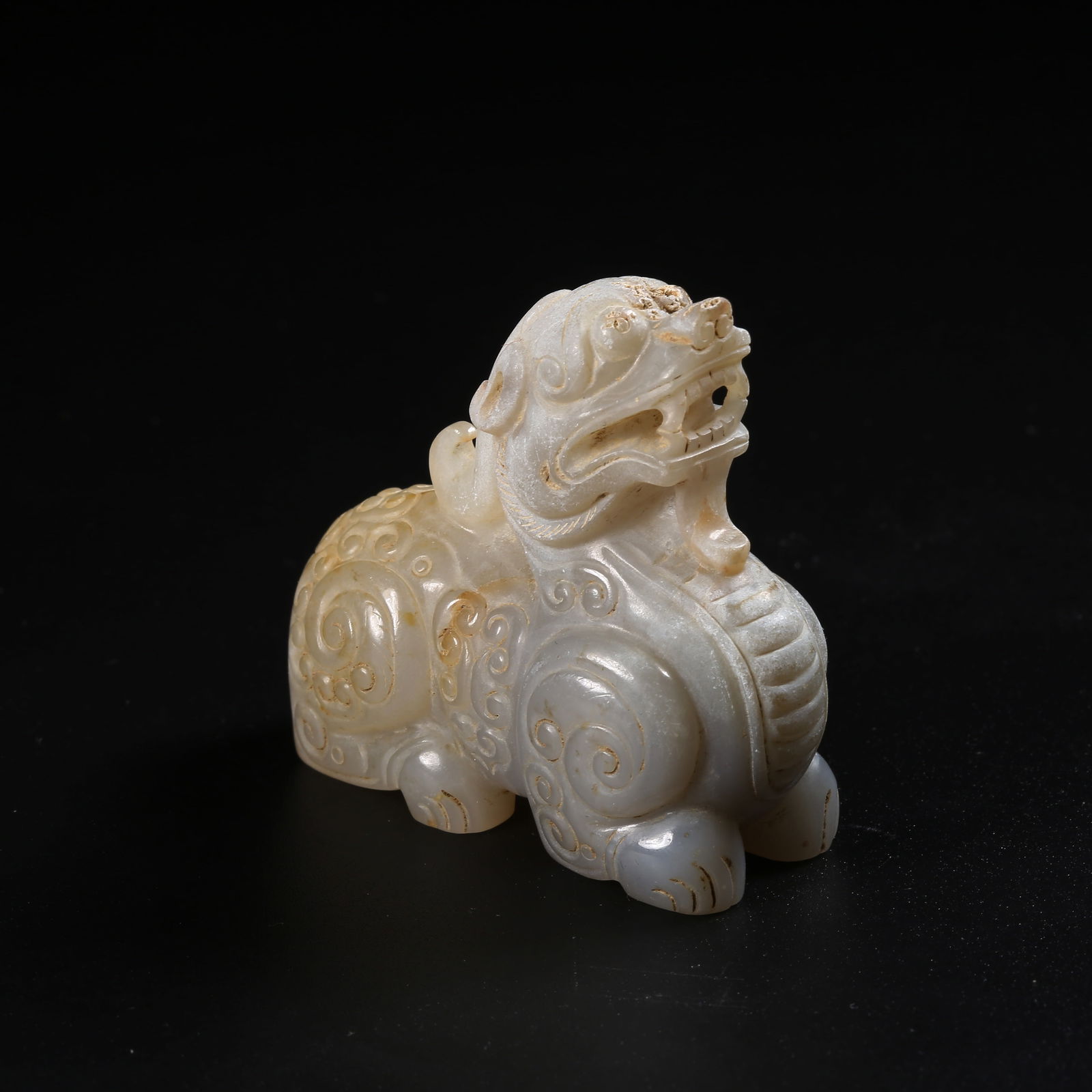 A ARCHAIC JADE AUSPICIOUS BEAST ORNAMENT (1 of 8)