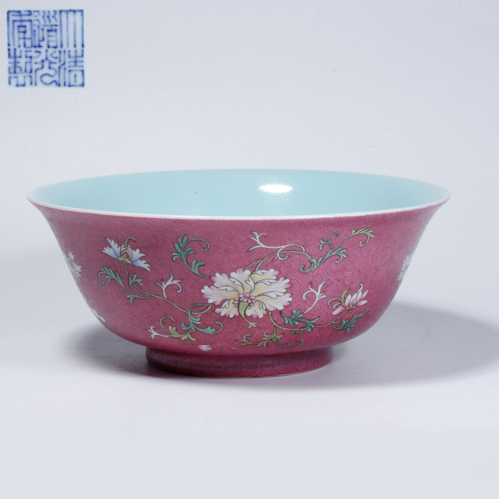 A PURPLE GLAZE BOWL WITH FLORAL DESIGN: Purple glaze bowl with floral design