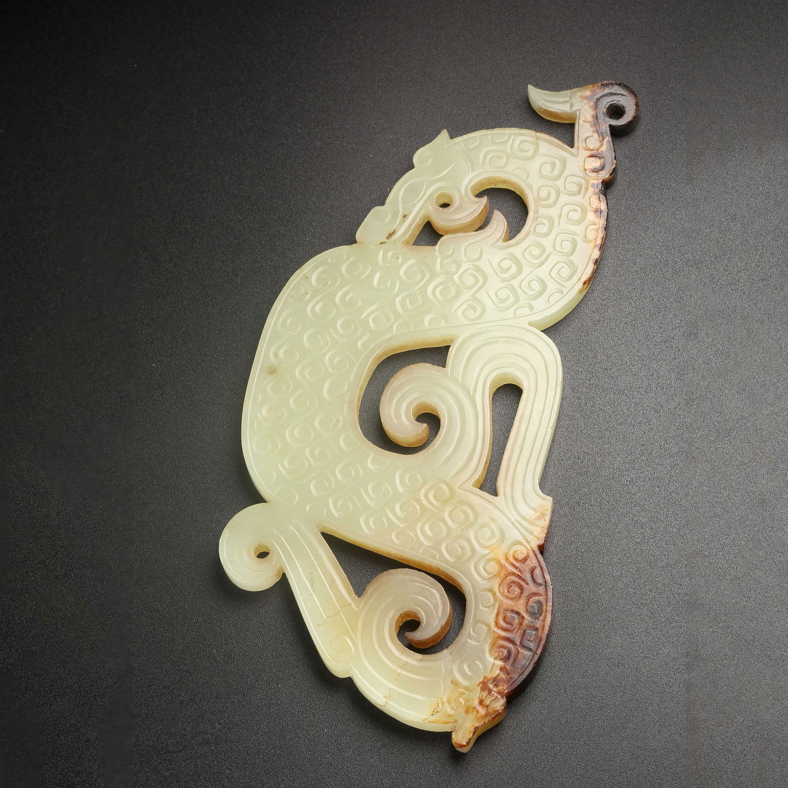 A ARCHAIC JADE S-SHAPED DRAGON PENDANT (1 of 10)