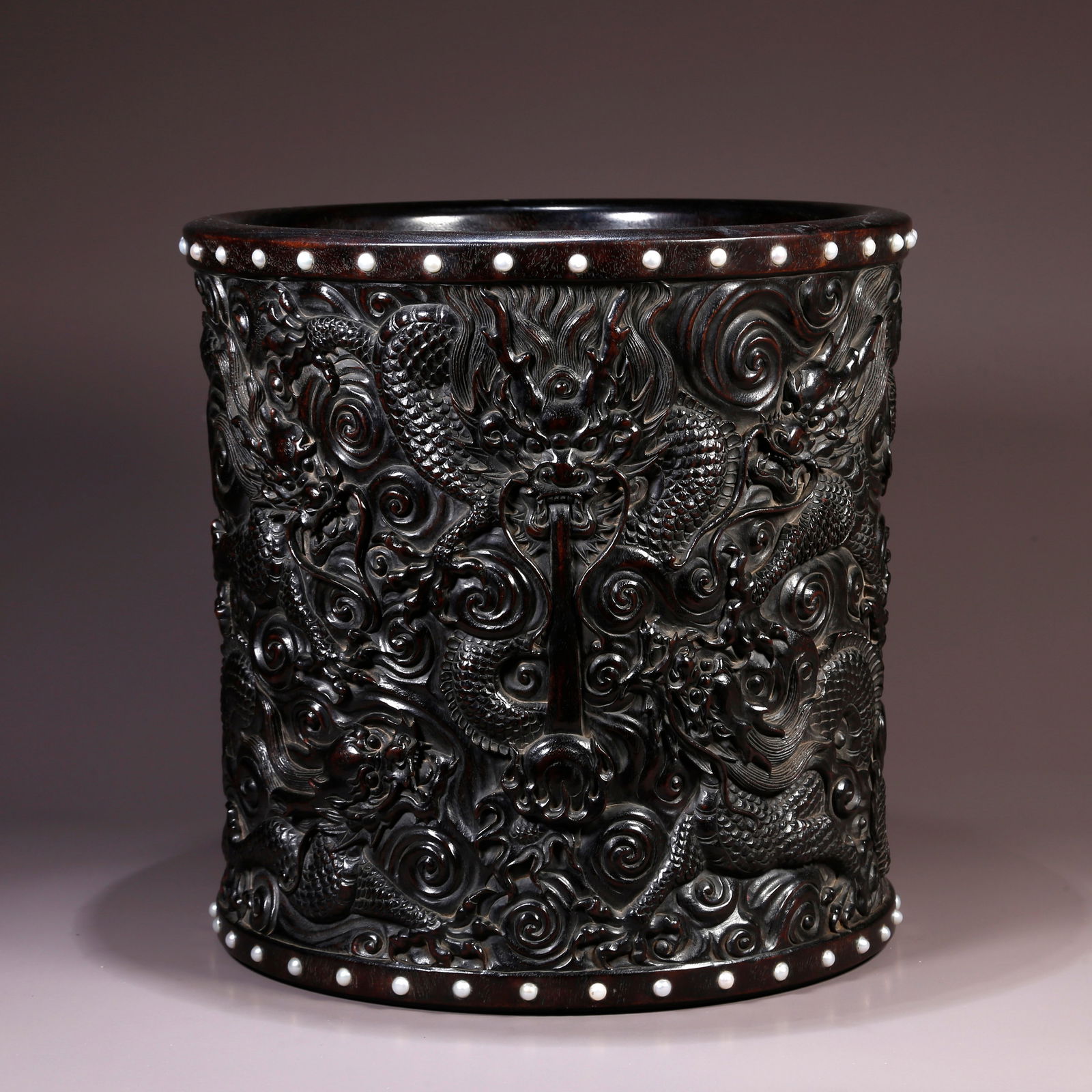 A ZITAN BRUSH POT CARVED WITH SEA-WATER DRAGON DESIGN: Zitan Brush Pot Carved with Sea-water Dragon Design