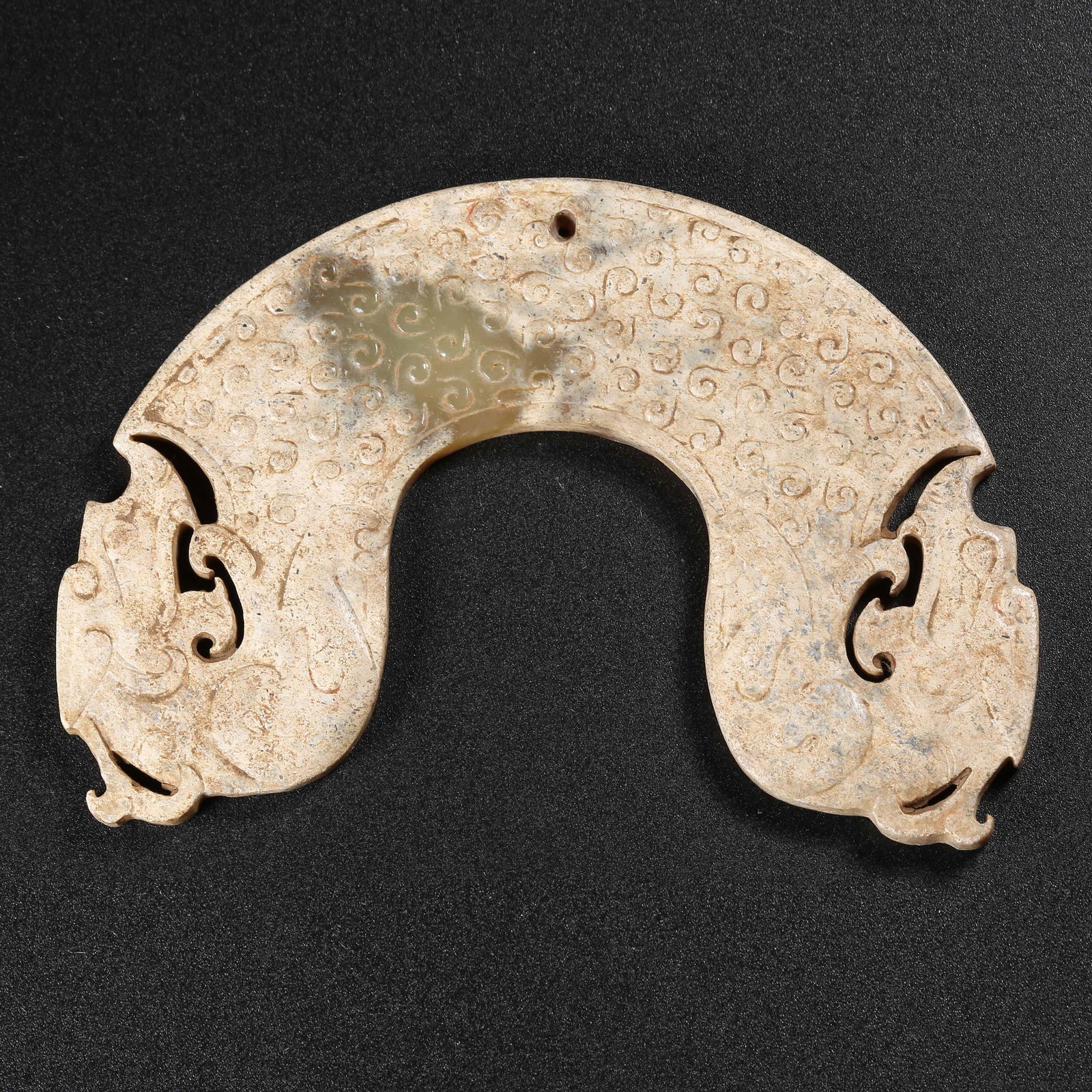 A ANCIENT JADE YUAN WITH DOUBLE DRAGON HEADS: Ancient Jade Yuan with Double Dragon Heads