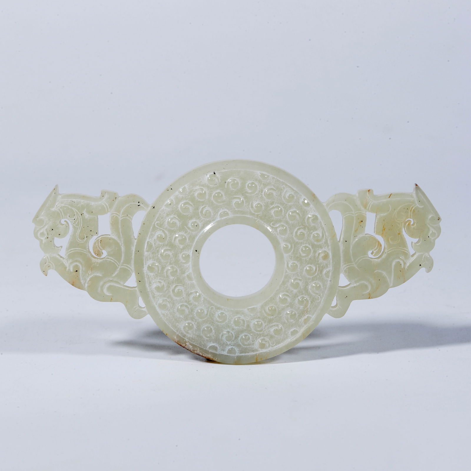 A HETIAN JADE BI DISC CARVED WITH BEAST PATTERN (1 of 9)