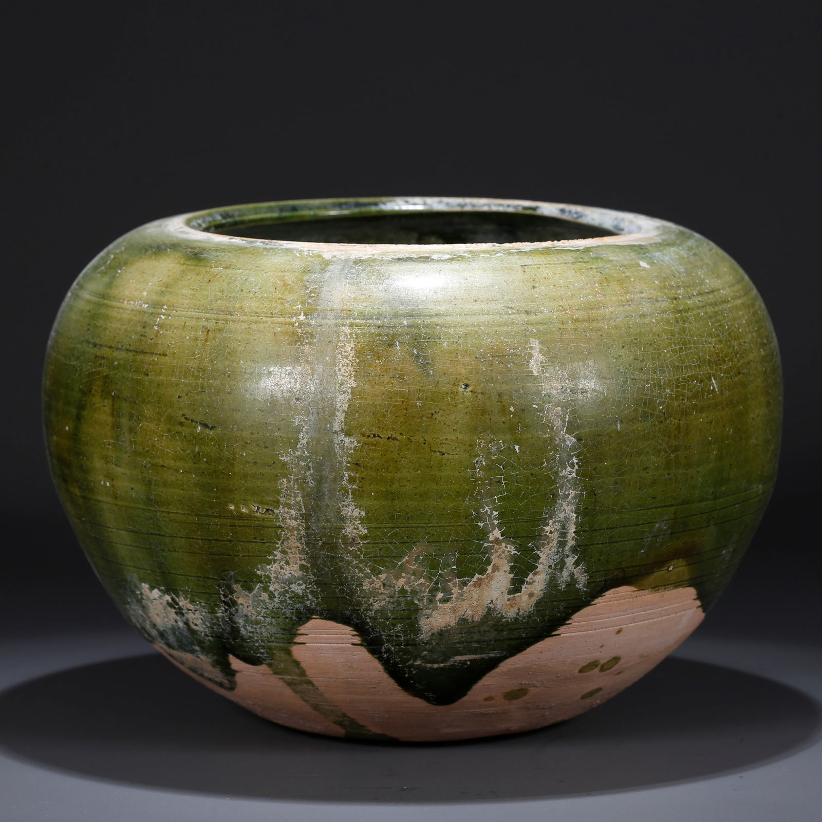A MARBLED GREEN-GLAZED JAR (1 of 9)