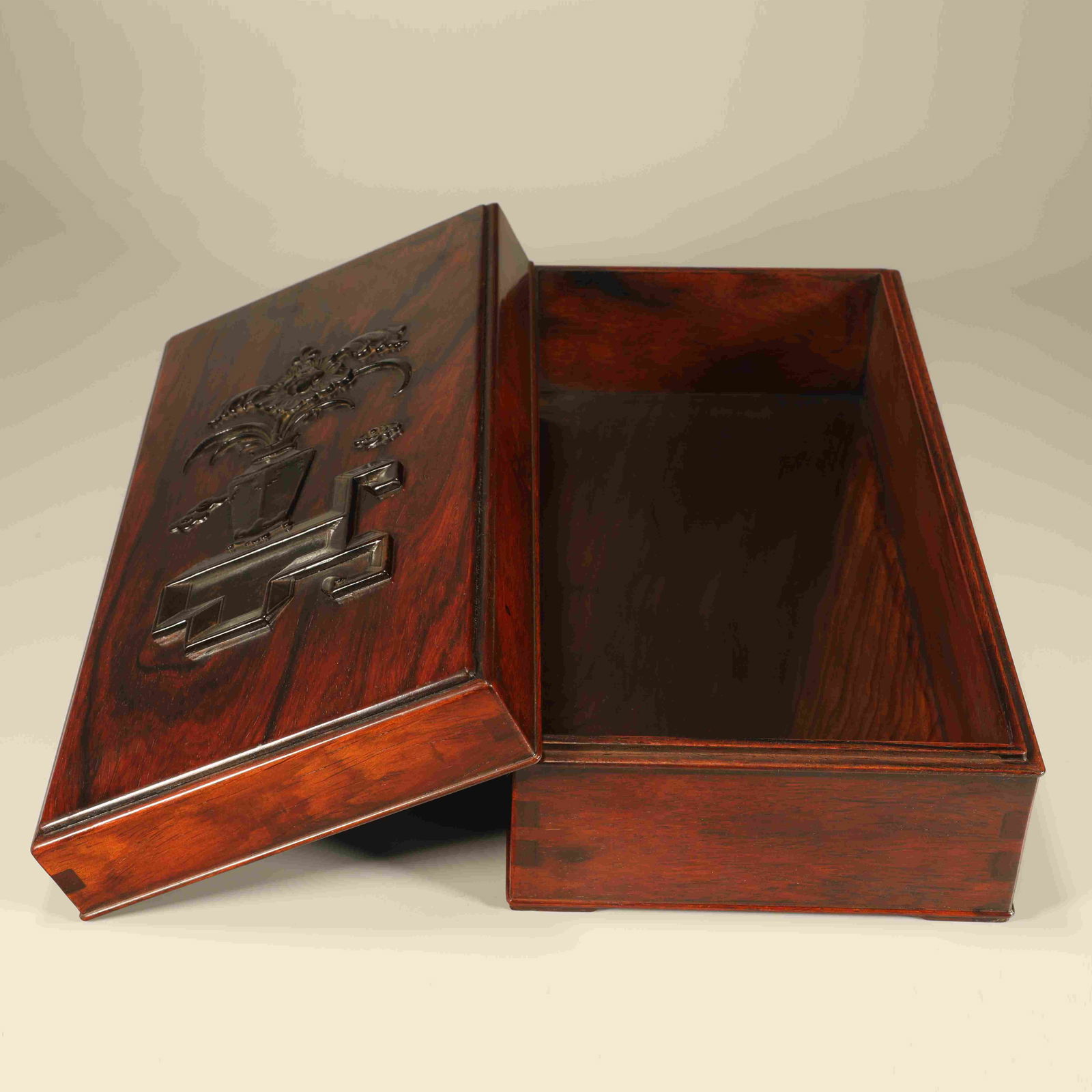 A HUANGHUALI AND ZITAN CARVED ANTIQUITIES PATTERN BOX (1 of 7)