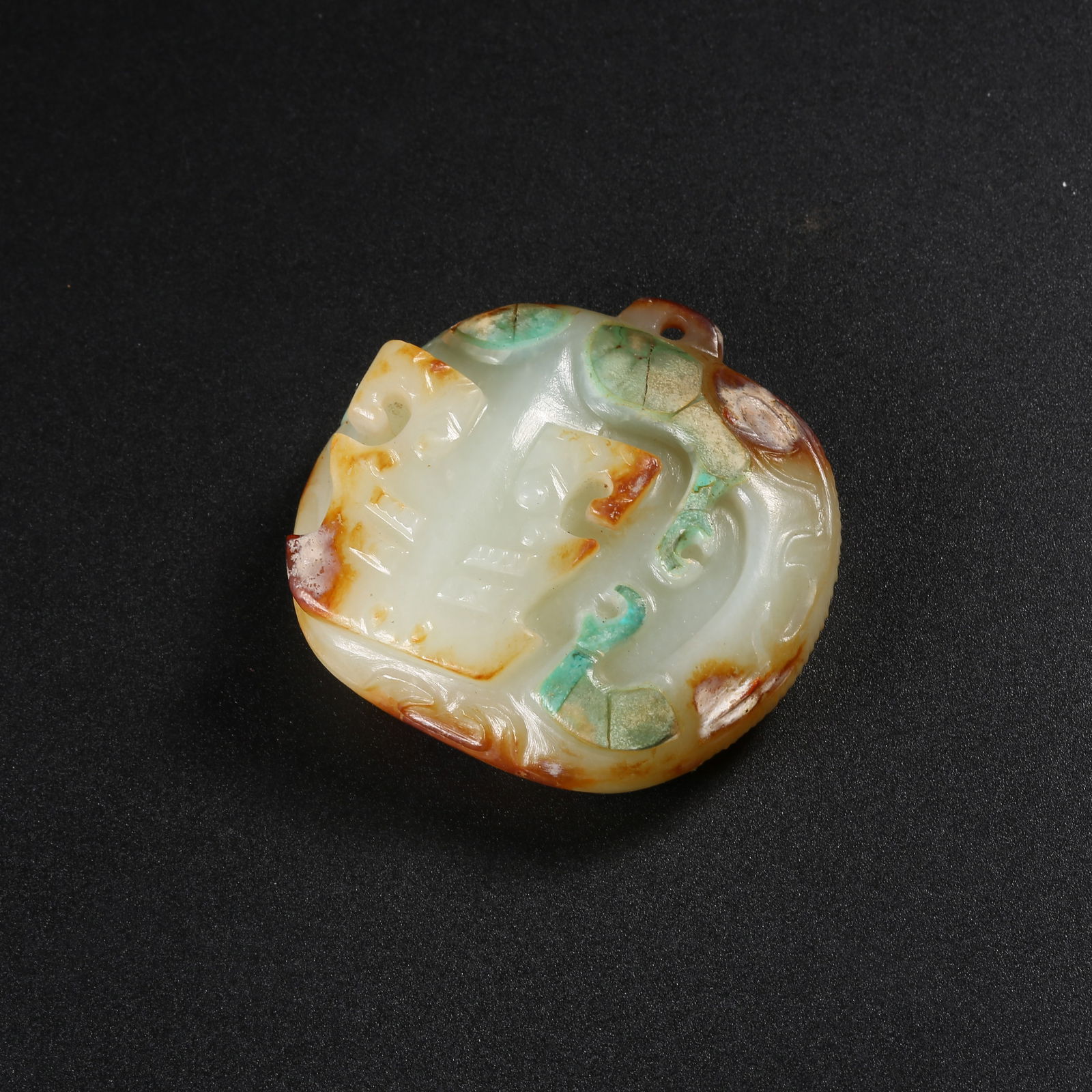 A ANCIENT JADE PENDANT WITH BEAST FACE DESIGN (1 of 9)