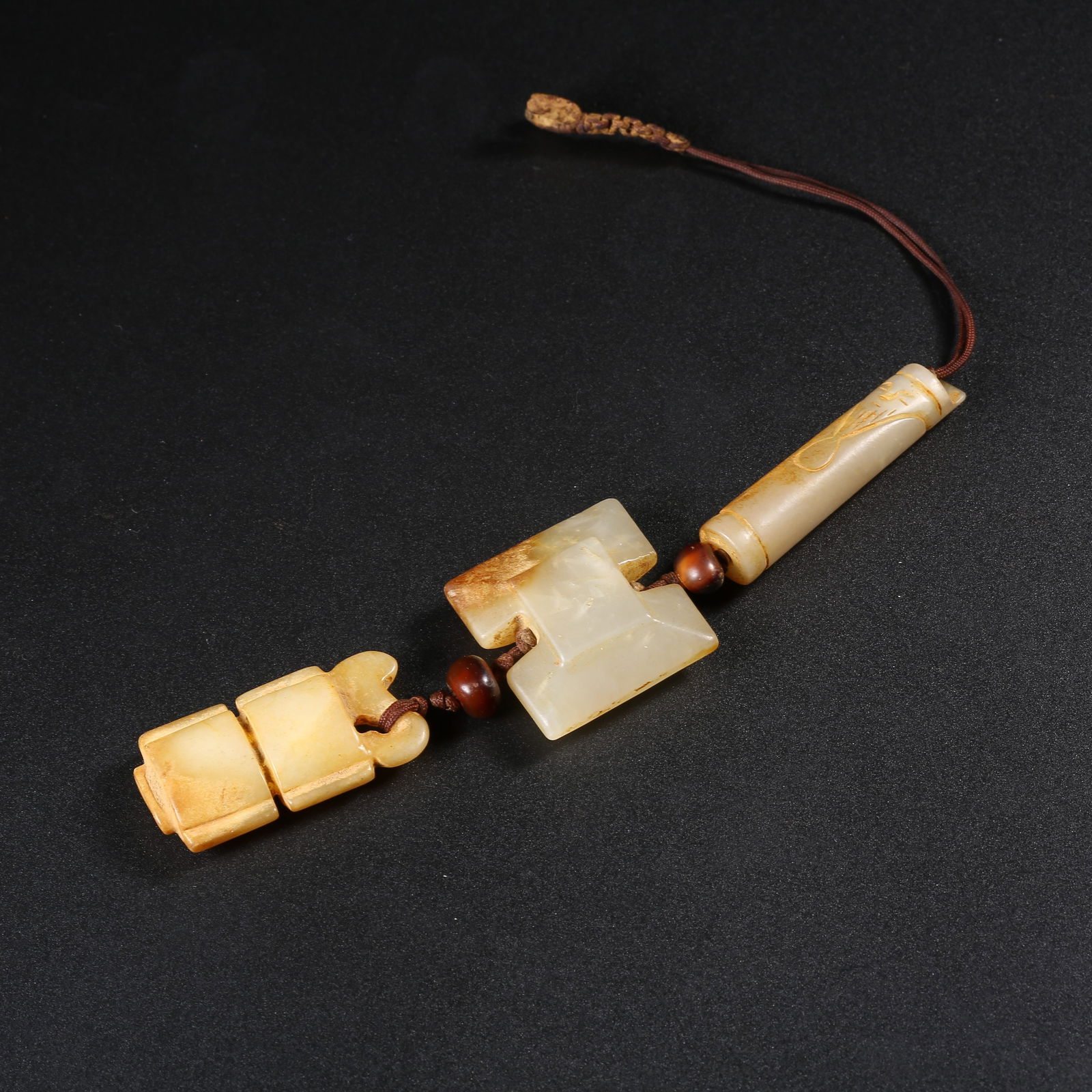 A SET OF ANCIENT JADE PENDANTS (1 of 7)