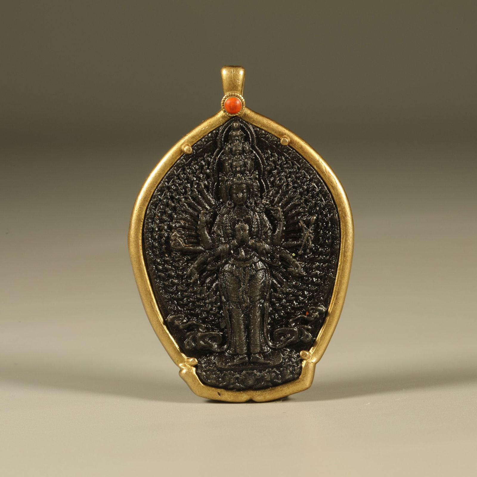A IRON THOUSAND-ARMED AVALOKITESHVARA PENDANT (1 of 6)