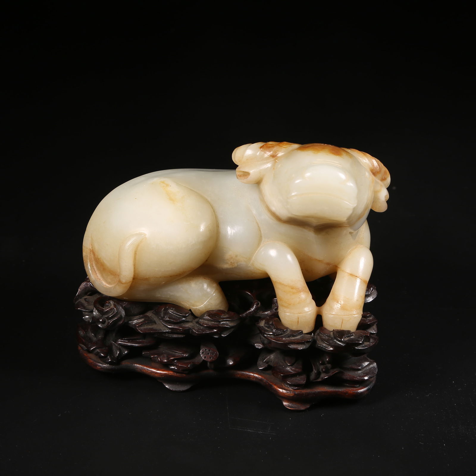 A HETIAN JADE RECUMBENT OX ORNAMENT (1 of 9)
