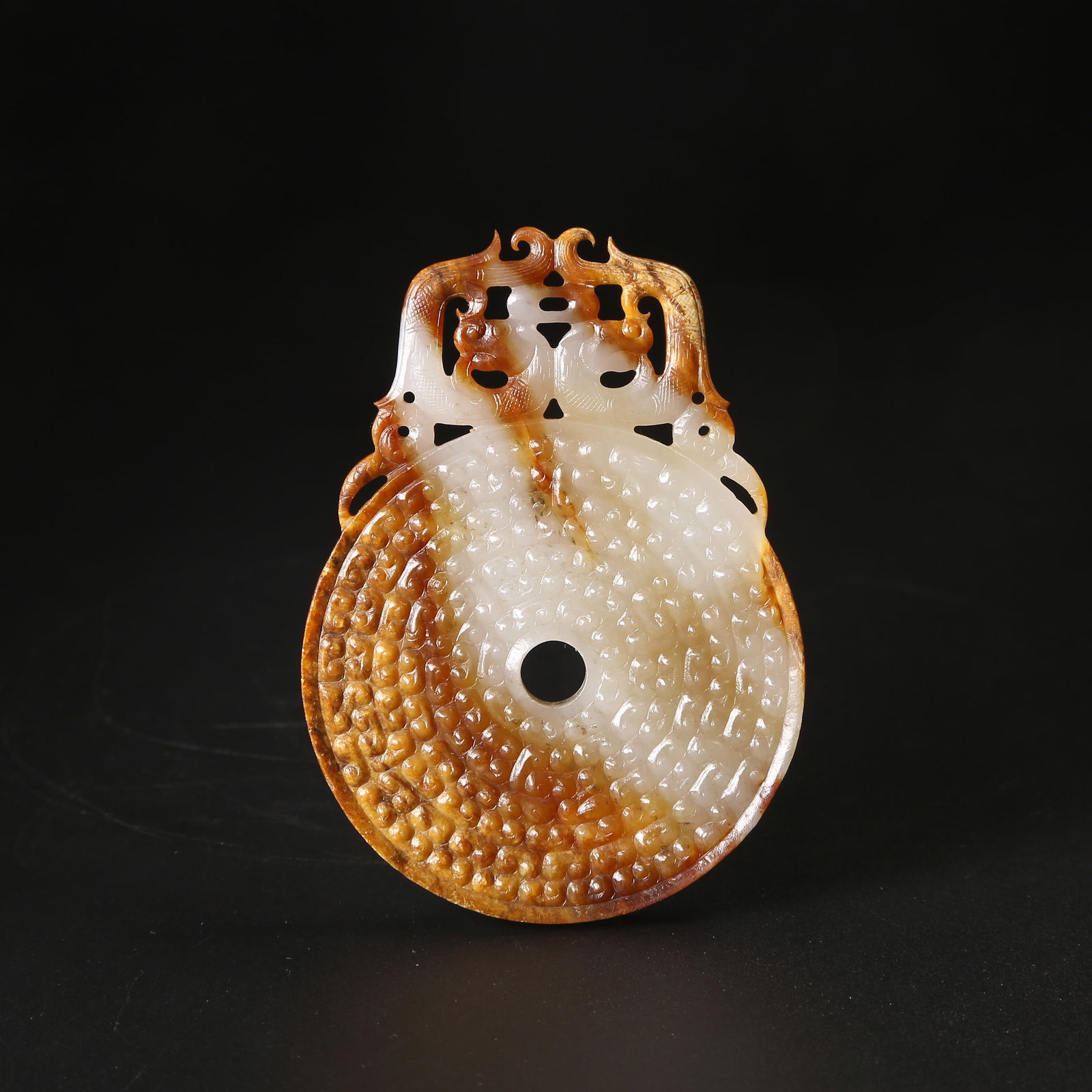 A ANCIENT JADE BI DISK WITH DOUBLE-DRAGON MOTIF (1 of 10)