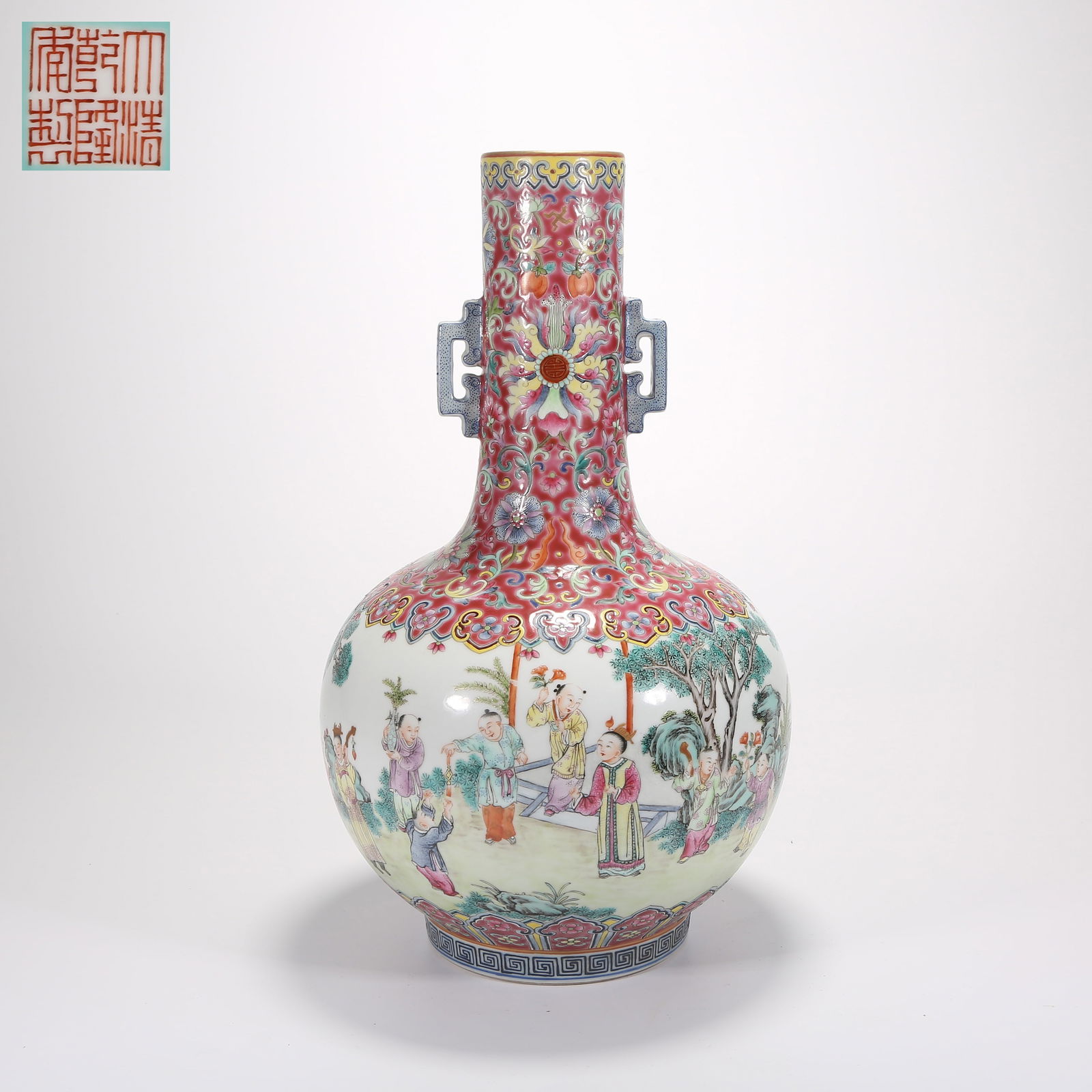A FAMILLE-ROSE LONG-NECK VASE WITH TWIN HANDLES AND "HUNDRED BOYS AT PLAY" MOTIF: Famille-rose long-neck vase with twin handles and "Hundred Boys at Play" motif