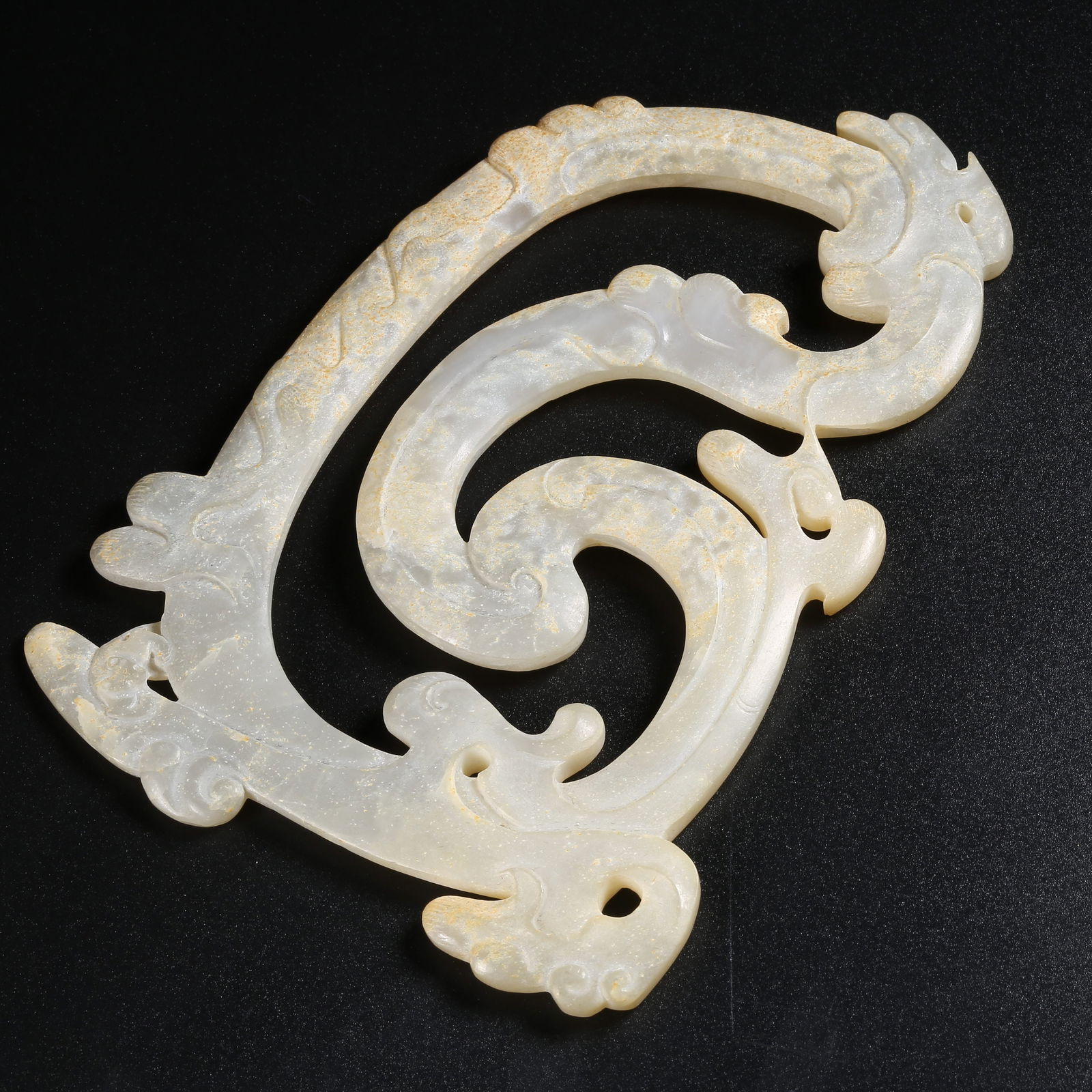 A ARCHAIC JADE PENDANT WITH DRAGON MOTIFS (1 of 9)