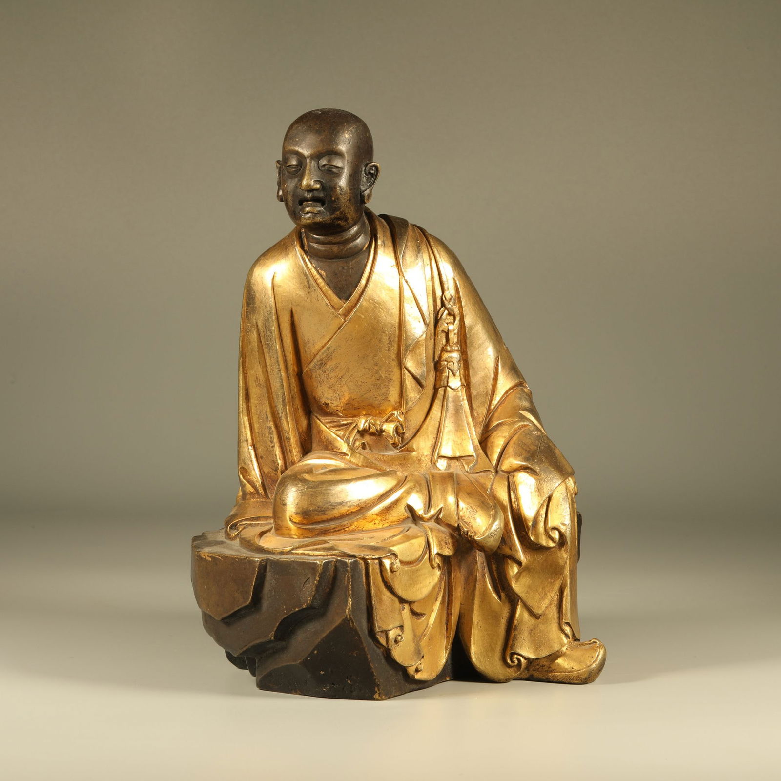 A GILT-BRONZE ARHAT STATUE (1 of 6)