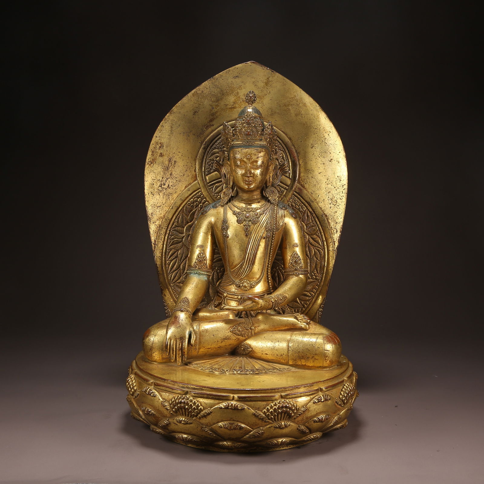 A GILT BRONZE SHAKYAMUNI IN MONGOLIAN NORTHERN STEPPE STYLE (1 of 9)
