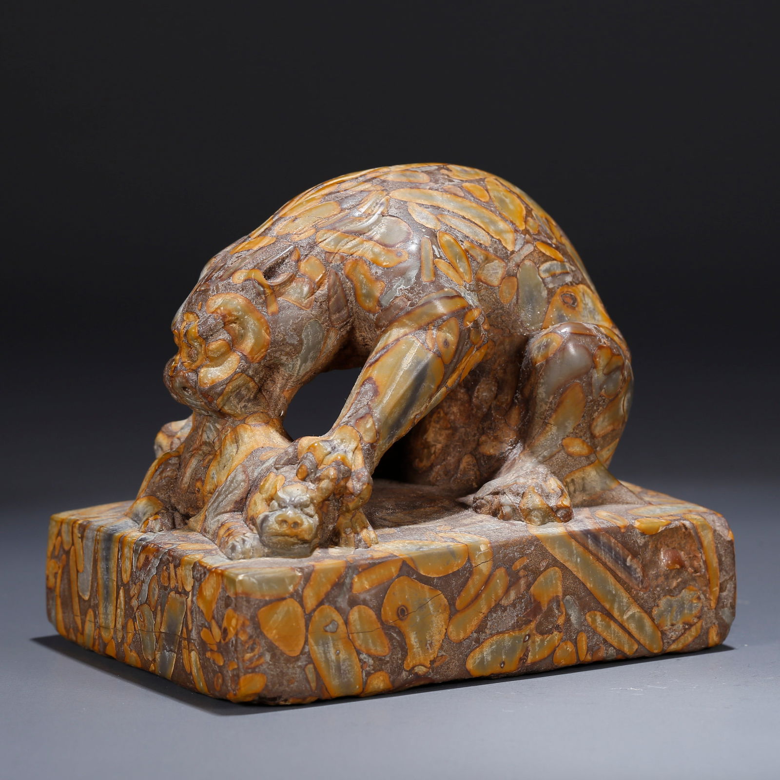 A FIVE-COLOR STONE AUSPICIOUS BEAST ORNAMENT: Five-Color Stone Auspicious Beast Ornament